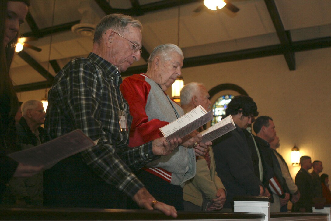 Veterans of the Battle of Tarawa, active-duty service members and family, attend a memorial ceremony Nov. 20 at the Protestant Chapel here to commemorate and pay tribute to those who made the ultimate sacrifice during the battle.  Many of the veterans were astonished that 65 years later their sacrifices and efforts were still being recognized.  “It’s amazing that a three-day battle during World War II is still being remembered,” said Henry C. Norman, a native of Springhill, Fla. and veteran of the battle. “But I think it’s very important for Americans to remember the past and to honor those who have sacrificed for their country.” (Official U.S. Marine Corps photo by Lance Cpl. Casey Jones) (RELEASED)