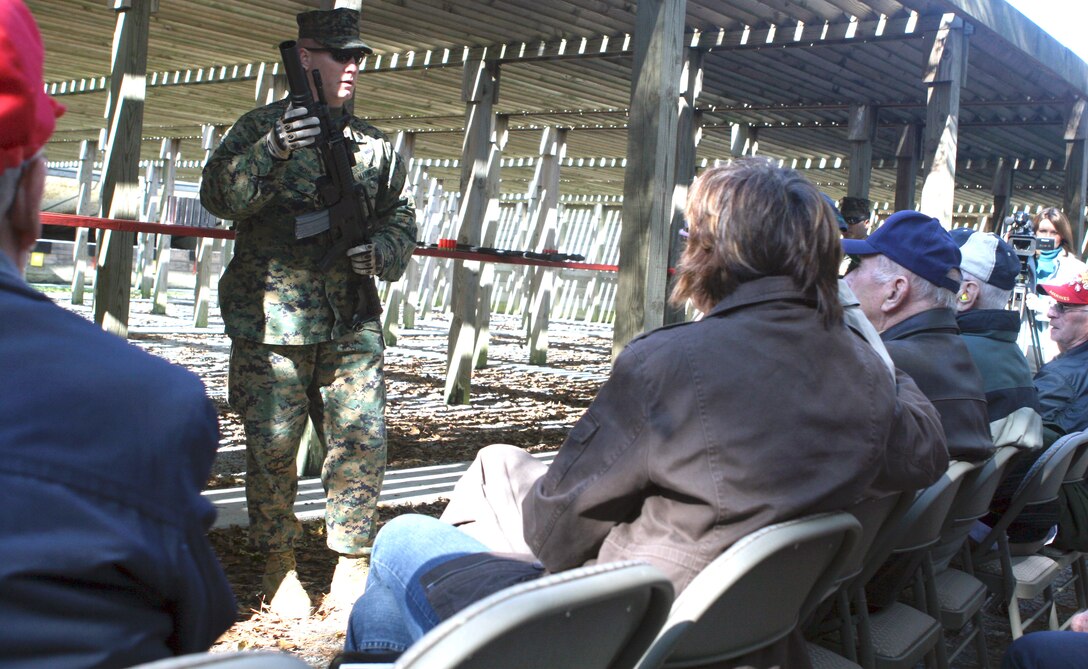 – Staff Sgt. Jeremy D. Gohl, a non-lethal weapons training instructor, demonstrates the uses of non-lethal weapons to a group of Battle of Tarawa, World War II veterans, Nov. 20. The veterans said they were taken back by the amount of attention they were given and the tremendous amount of respect paid to them by the hosting 2nd Marine Regiment. (Official U.S. Marine Corps photo by Lance Cpl. Casey Jones) (RELEASED)