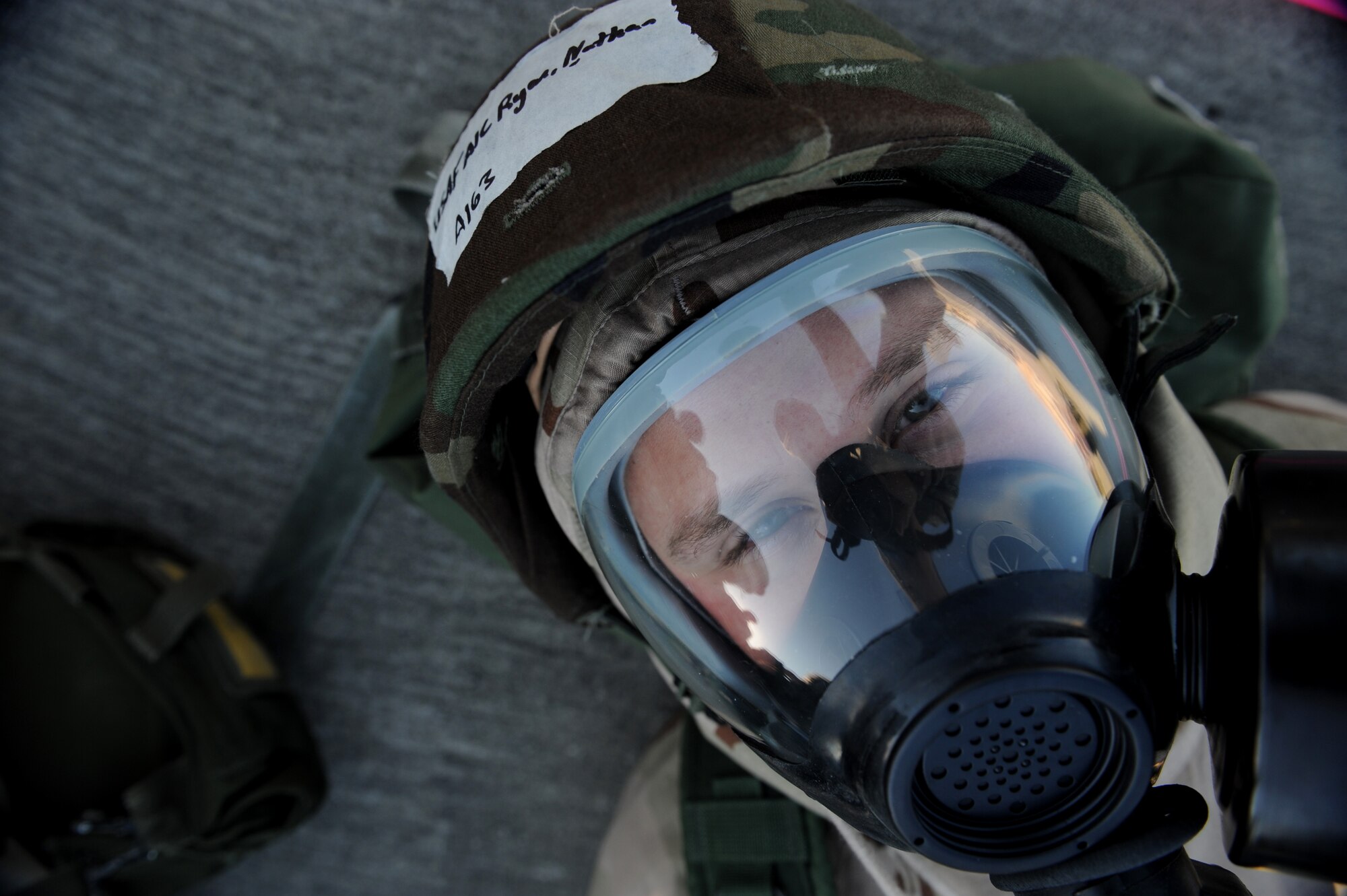 MOODY AIR FORCE BASE, Ga. -- Airman 1st Class Nathan Ryan, 723rd Aircraft Maintenance Squadron engine technician, idresses in a Mission Oriented Protective Posture level four ensemble while in alarm black during an operational readiness exercise here Nov. 20. The purpose of this exercise was to test the base's wartime capabilities. (U.S. Air Force photo by Senior Airman Gina Chiaverotti)