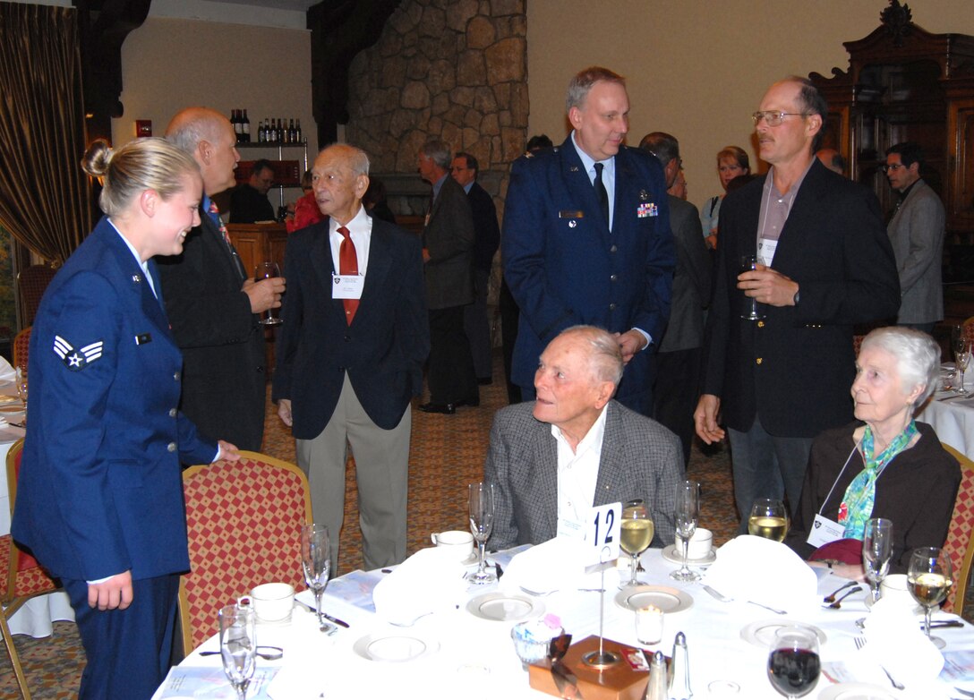 Future and past American Airmen meet...Senior Airman Emily Kuhl and Col. Jeff Johnson (in blue uniforms) met various 40th Bomb Group veterans and their families in St. Louis during a reunion where they shared stories from World War II.  (U.S. Air Force photo/Maj. Stan Paregien)