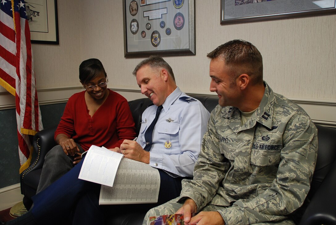 The Combined Federal Campaign was successful again, and donation forms and booklets were available throughout the wing until Nov. 17. The program makes it easy to donate money to your favorite CFC-approved charity.  Chairpersons Clarissa Squalls, commander Col. John C. Flournoy, Jr., and Capt. Troy Appel sat down to look over the various options during the campaign.  The 932nd Airlift Wing is an Air Force Reserve Command unit located at Scott Air Force Base, Ill.  (U.S. Air Force photo/Maj. Stan Paregien)