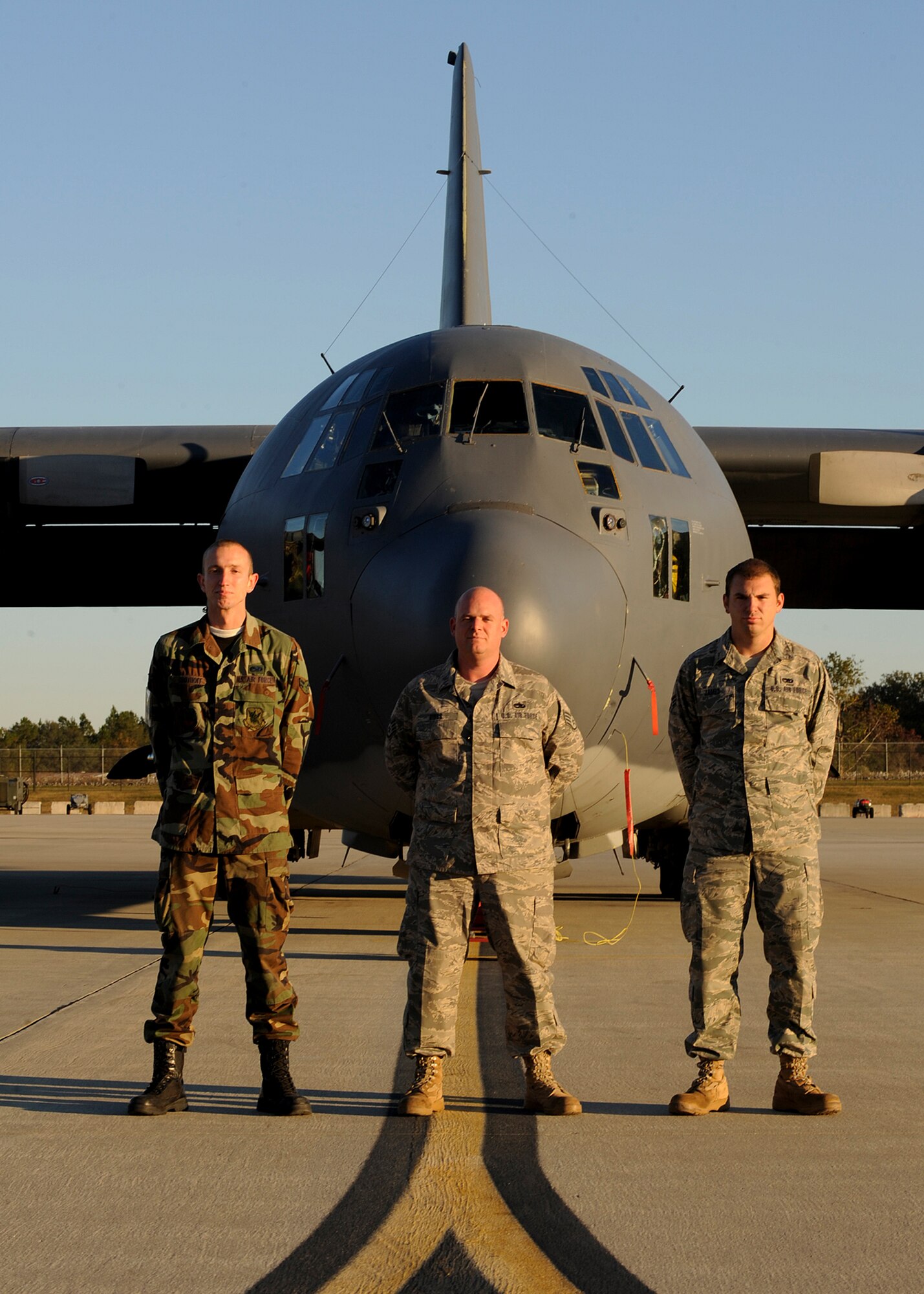 MOODY AIR FORCE BASE, Ga. -- (Left to right) Airman 1st Class Steven Grothoff, Staff Sgt. Ben Gibbs and Senior Airman Ryan James, 723rd Aircraft Maintenance Squadron HC-130P Hercules crew chiefs, recently accomplished a rare achievement in their career field here Nov. 10. The crew chiefs witnessed their C-130 fly with a black-letter initial, a special distinction achieved when an aircraft has zero discrepancies before flight. (U.S. Air Force photo by Senior Airman Brittany Barker) 