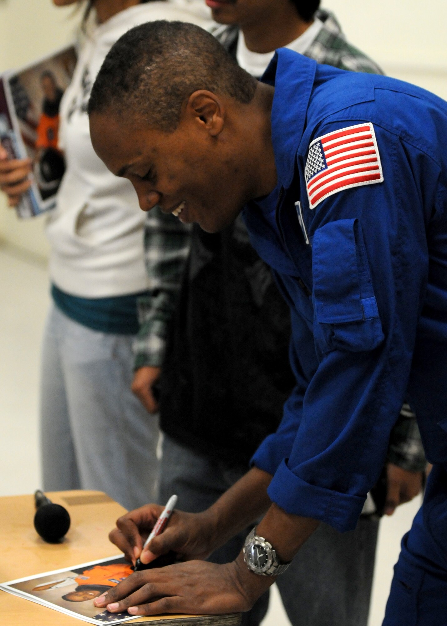 Air Force Astronaut Col. B Alvin Drew signs autographs for students at Westchester High School, Nov. 20. The colonel visited the school to talk to students about his space experiences. His visit was one of many events held during Air Force Week in Southern California. (U.S. Air Force photo by Stephen D. Schester)