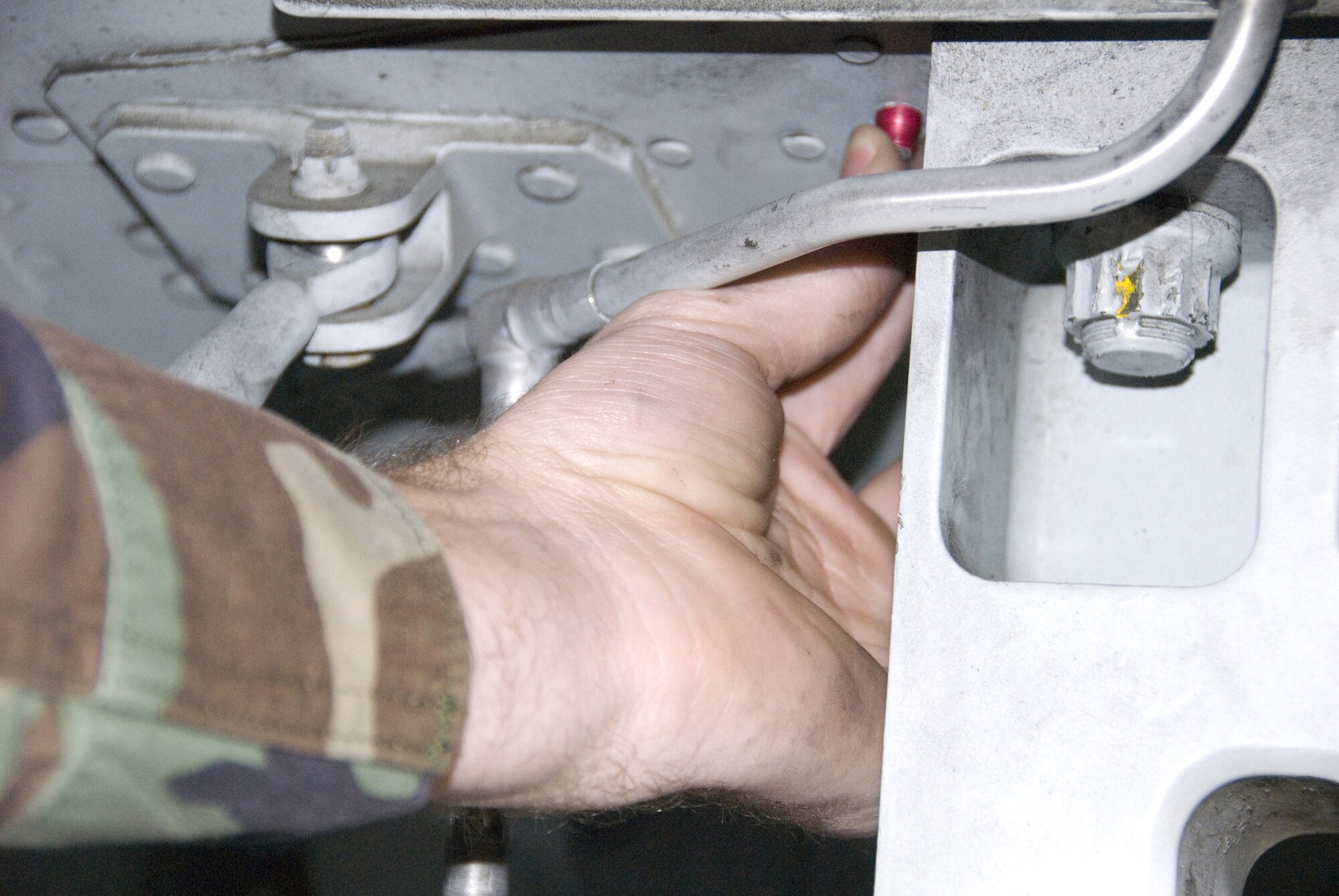 Staff Sgt. Micah Gaches checks the rivets on a 442nd Fighter Wing A-10 as part of a mandatory inspection across the Air Force's A-10 fleet to look for very small cracks in certain airplanes.  (U.S. Air Force photo/Masterr Sgt. Bill Huntington)