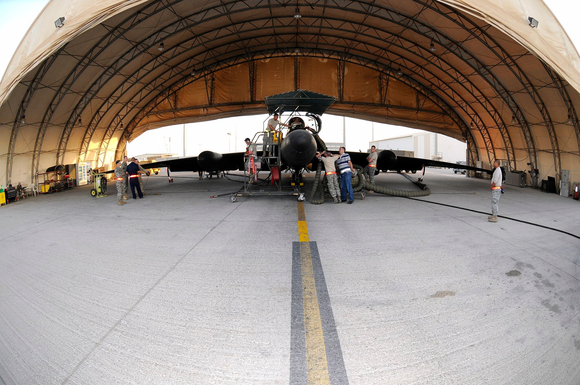 Members of the 99th Expeditionary Reconnaissance Squadron prepare a U-2 Dragonlady for flight Nov. 14 at an air base in Southwest Asia. The 99th ERS is responsible for gathering intelligence in the area of responsibility in support of operations Iraqi and Enduring Freedom. (U.S. Air Force photo/Tech. Sgt. Christopher A. Campbell)