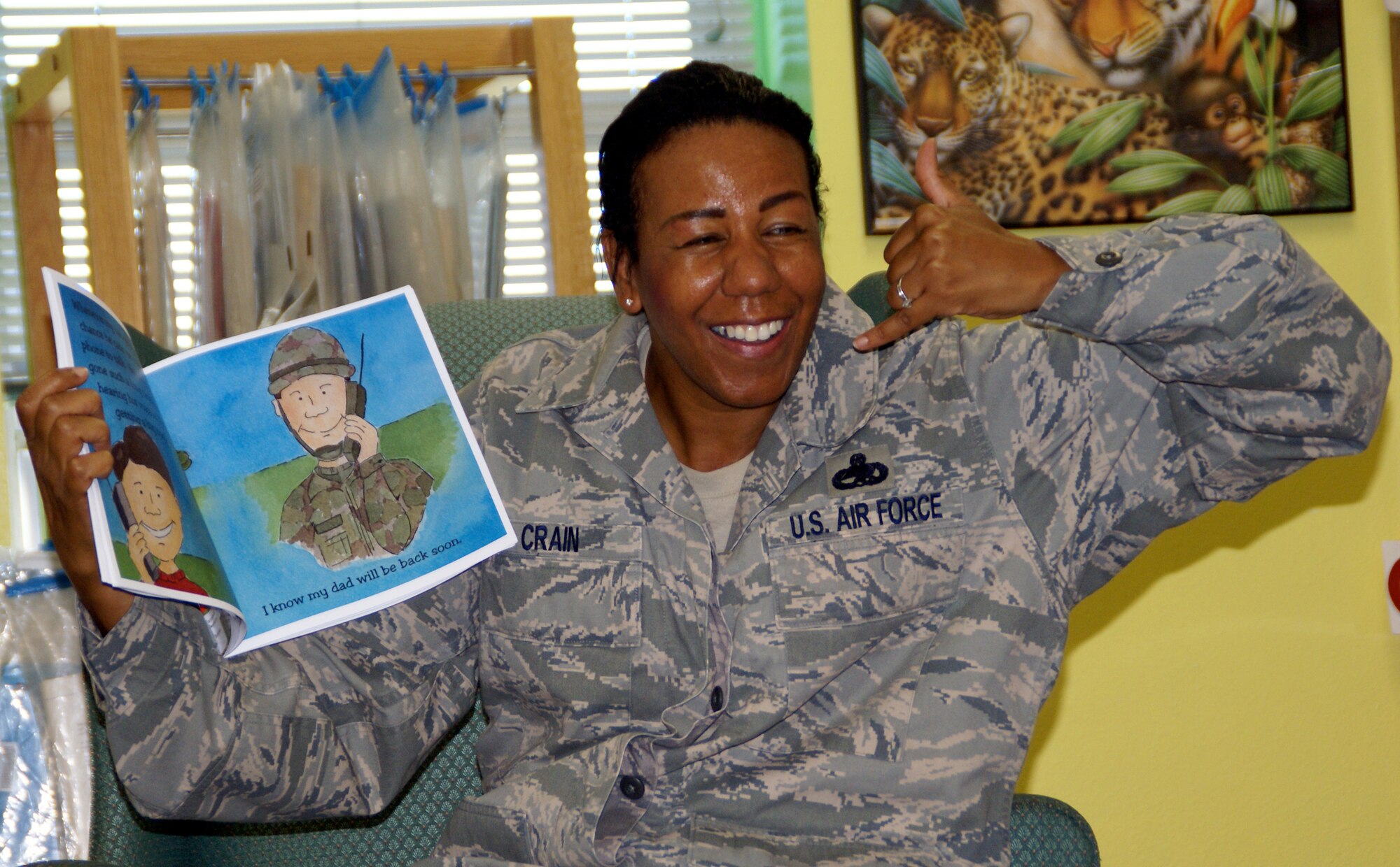 EGLIN AIR FORCE BASE, Fla. -- Master Sgt. Juanita Crain, 96th Security Forces first sergeant, reads to preschool children during Story Time, at the Eglin Base Library Nov. 13. Story Time is a program designed to encourage children to read. The library has implemented other programs and expanded new sections dedicated to deployed Airmen and their family members that help relieve some of the stress that accompany deployment. (US Air Force photo/ Joshua Bausch)                 