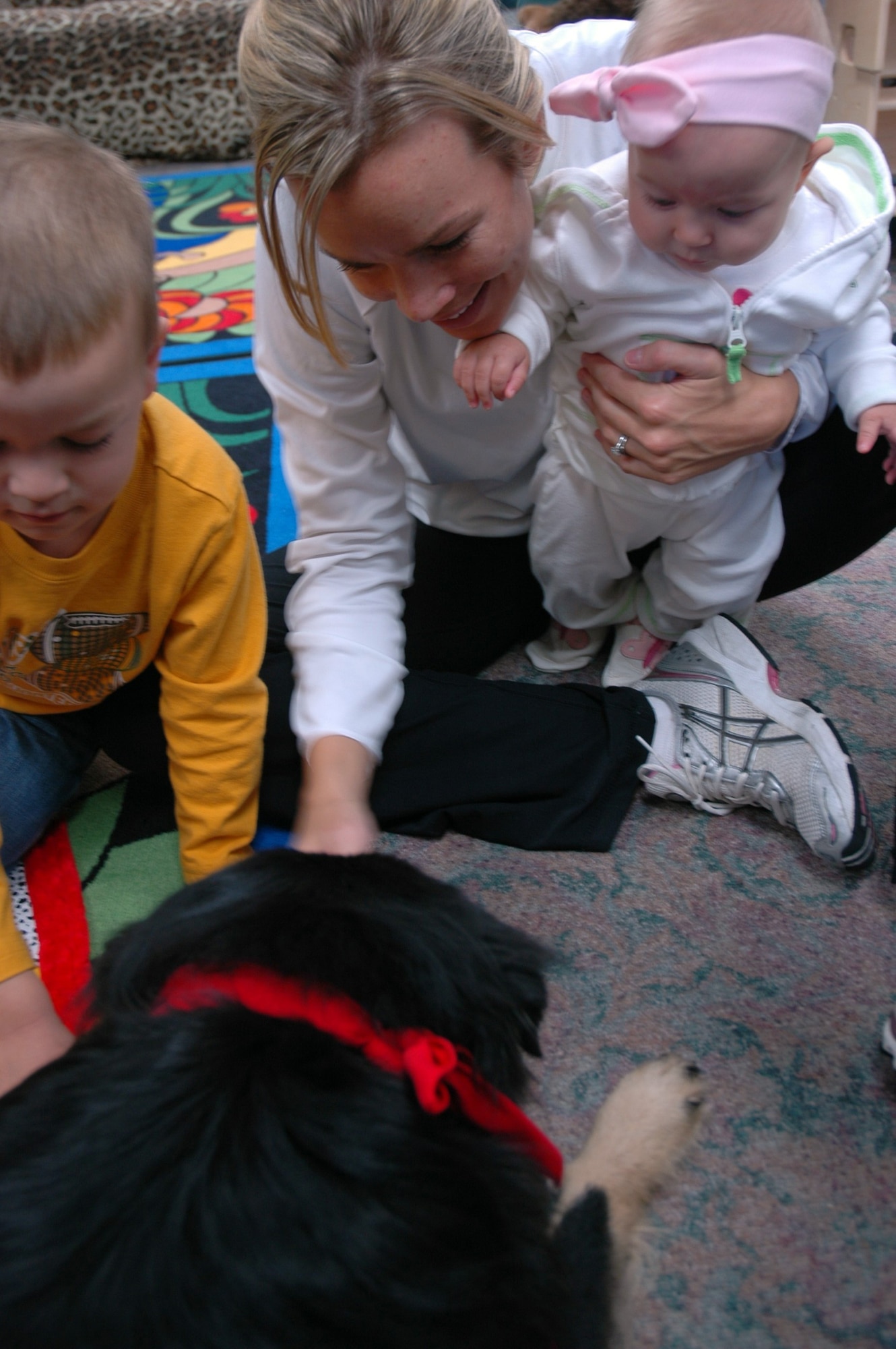 EGLIN AIR FORCE BASE, Fla. -- The Eglin Base Library continues their commitment to the community as a focal point for knowledge and growth by implementing programs such as the Read-2-Dog program during Story Time, which encourages children to read in a unique and fun way. The library also has implemented other programs and expanded new sections dedicated to deployed Airmen and their family members that help relieve some of the stress that accompany deployment. (US Air Force photo/ Airman 1st Class Anthony Jennings)