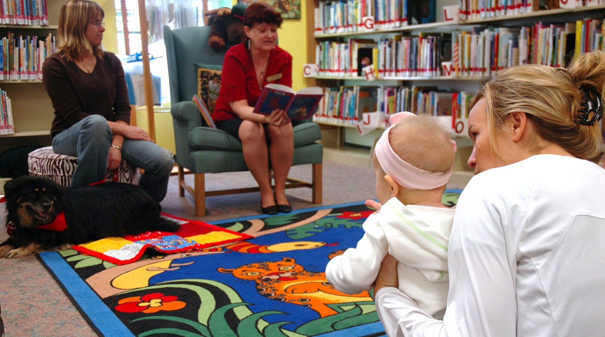 EGLIN AIR FORCE BASE, Fla. -- The Eglin Base Library continues their commitment to the community as a focal point for knowledge and growth by implementing programs such as the Read-2-Dog program during Story Time, which encourages children to read in a unique and fun way. The library also has implemented other programs and expanded new sections dedicated to deployed Airmen and their family members that help relieve some of the stress that accompany deployment. (US Air Force photo/ Airman 1st Class Anthony Jennings)