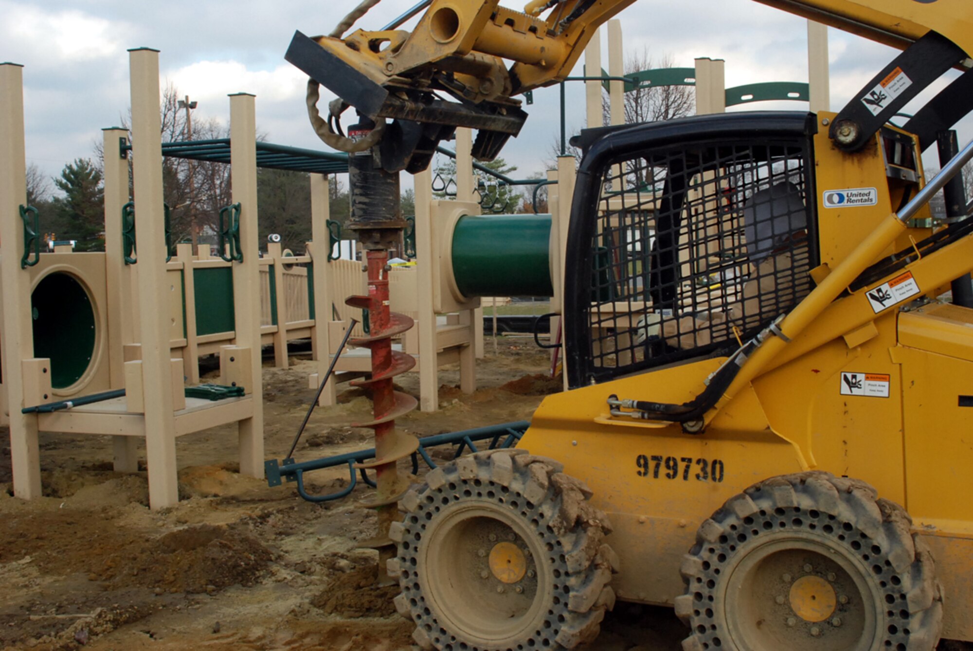Chriss Marshman, a private contractor, operates a skid steer while constructing the new Wacky World playground near the Arnold Gate Nov. 20. He and his partner, Michael Williams, have been working on the playground for one week; depending on weather, its scheduled completion date is Nov. 28. The 305th Civil Engineer Squadron’s operation support section is overseeing the project. The new playground is Americans with Disabilities Act compliant, accommodates more than 200 children ages 5-12, is made from all recycled high-density plastic, and will have 62 elevated components. A shredded rubber base will be used throughout the playground and new picnic tables and benches will be located at the site. (U.S. Air Force photo/Airman 1st Class Bekah Phy)