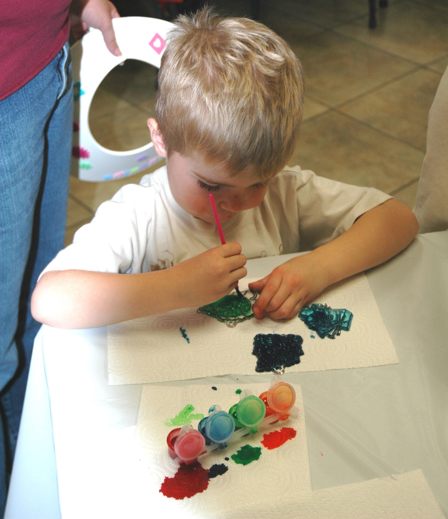 Justin Greene completes a craft project during the Deployed Spouses' Dinner Nov. 13 at the Luke Community Chapel.  This month's event was hosted by the 944th Fighter Wing with generous donations from the Fighter Country Partnership and Basha's grocery stores.  The Base Exchange and Commissary also donated $50 gift certificate and a roaster oven to be given to the families in attendance.  (U.S. Air Force photo/Staff Sgt. Denise Willhite)