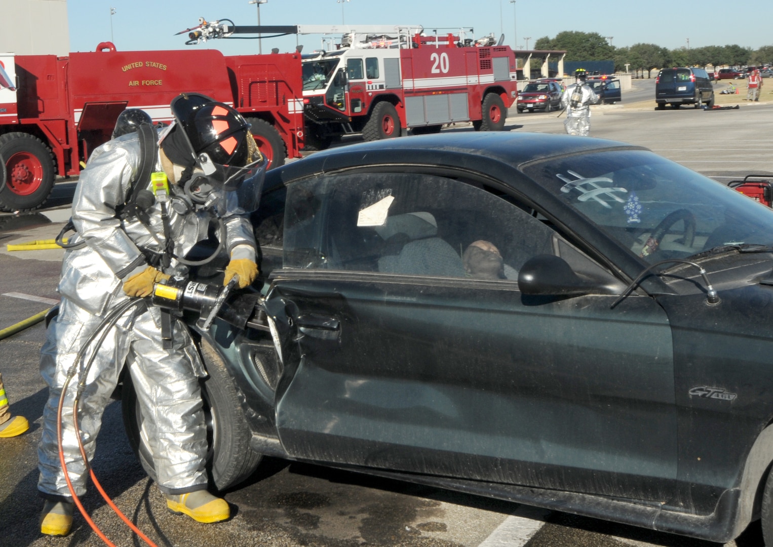 A firefighter uses the "jaws of life" to free a simulated victim during the exercise portion of the 2008 Operational Readiness Inspection at Randolph Air Force Base, Texas. (U.S. Air Force photo by Steve White)