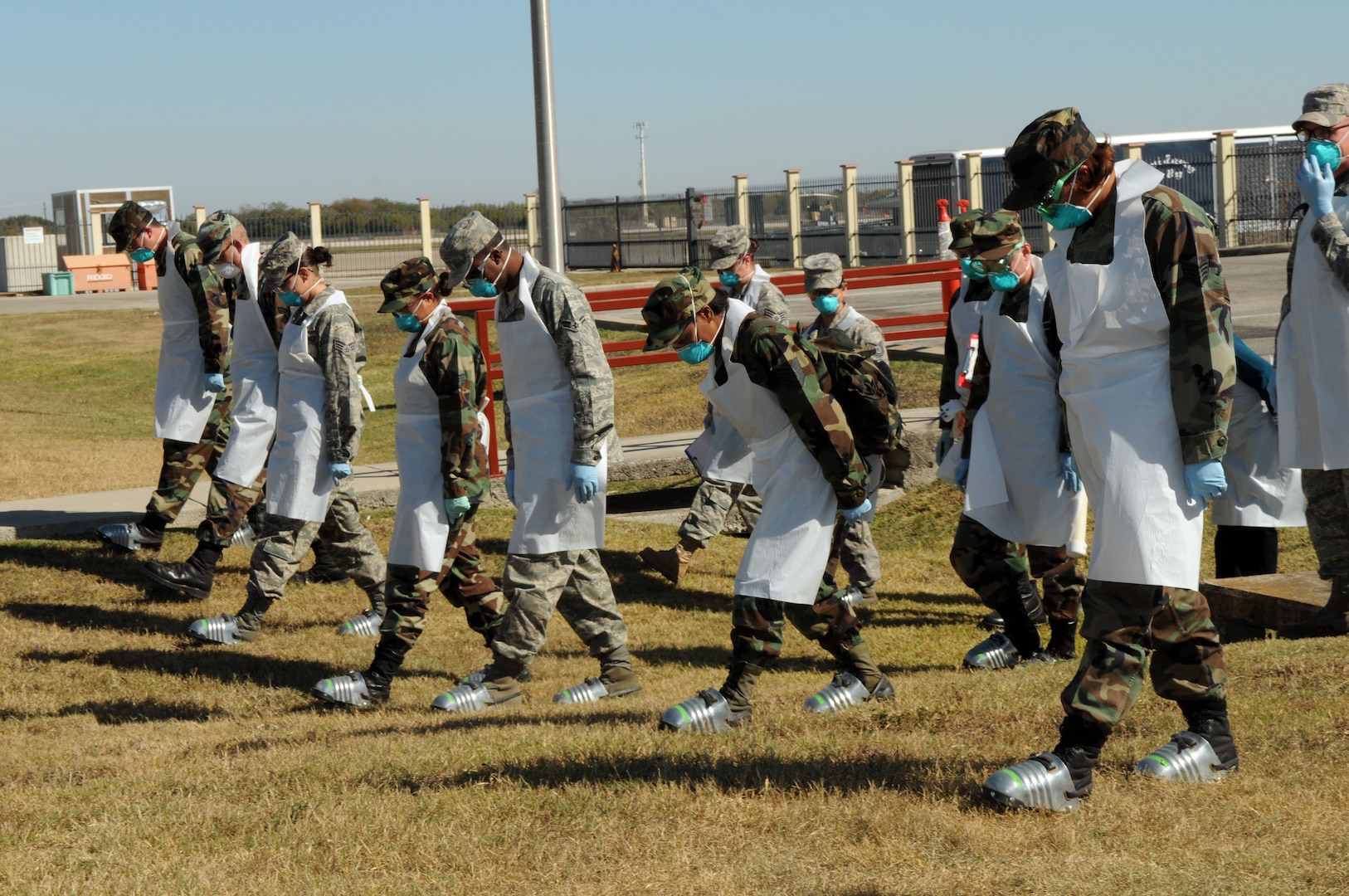 Members of the search and recovery team scoured the grounds of a simulated F-22 crash site for human remains during the exercise portion of the 2008 Operational Readiness Inspection at Randolph Air Force Base, Texas. (U.S. Air Force photo by Joel Martinez)
