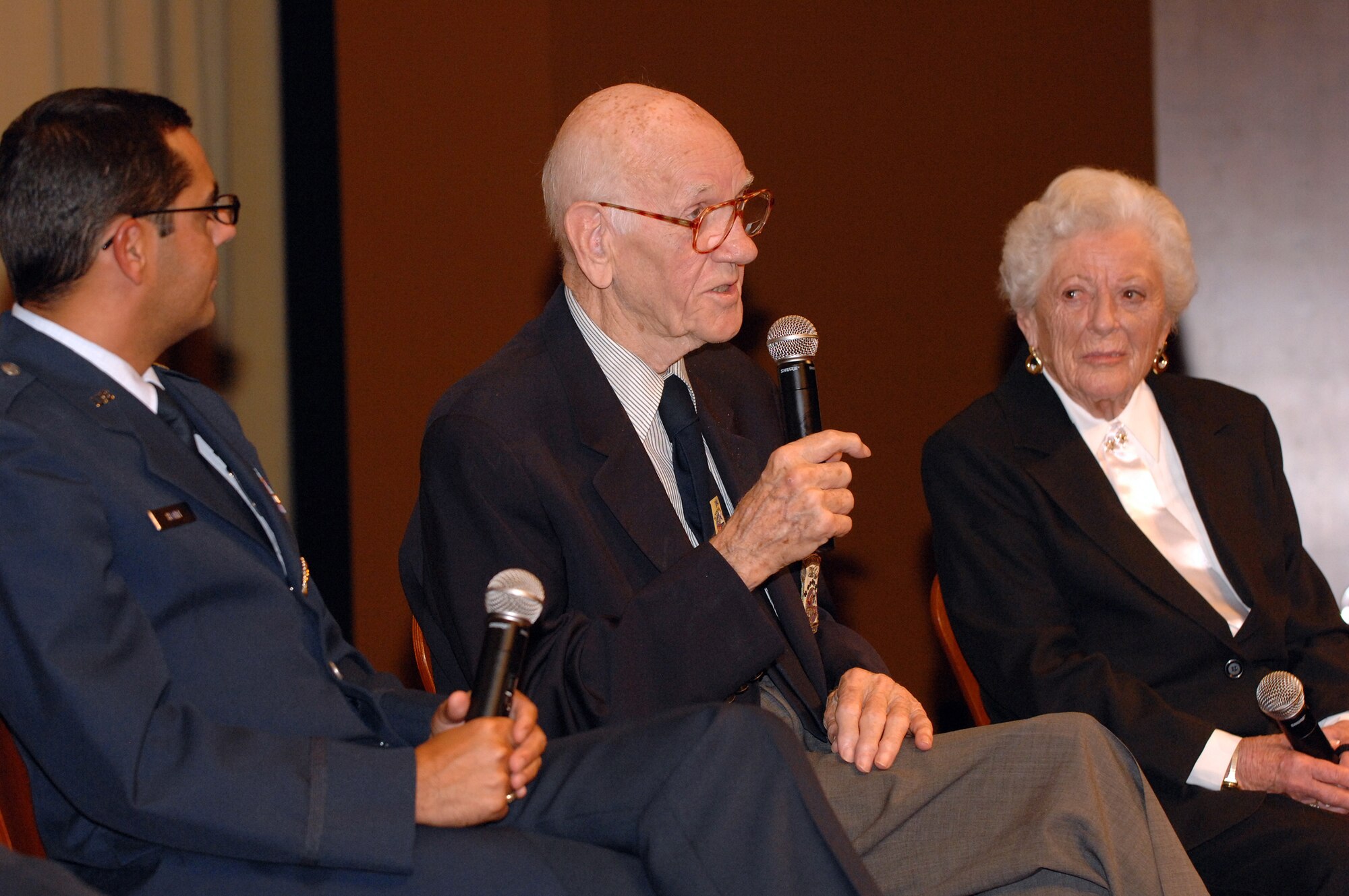 Air Force Lt. Col. (Ret) Thomas Griffin, one of the Doolittle Raiders, talks to the audience as Lt. Col. Francisco Hamm, Director of Public Affairs Entertainment Liaison Office, and Edith McClure, an Army nurse during World War II, listen before the showing of “Thirty Seconds Over Tokyo” part of Los Angeles Air Force Film Festival, Nov. 18, 2008. (U.S. Air Force photo by Senior Airman Ashley Moreno) 