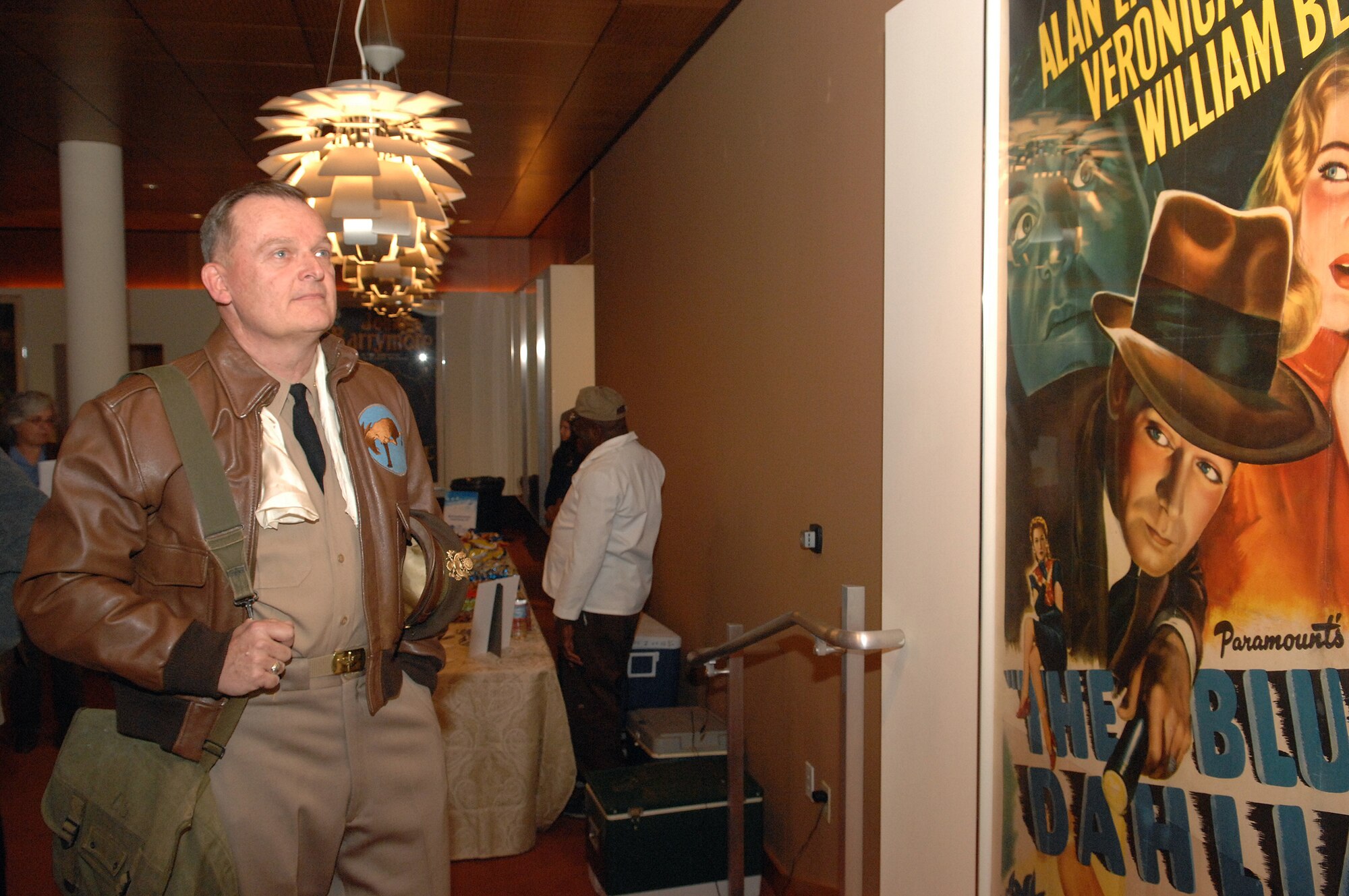 Scott Steele, wearing a World War II U.S. Army uniform, looks at a poster in the lobby at the Academy of Motion Picture Arts and Sciences before the showing of “Thirty Seconds Over Tokyo” part of Los Angeles Air Force Film Festival, Nov. 18, 2008. (U.S. Air Force photo by Senior Airman Ashley Moreno) 
