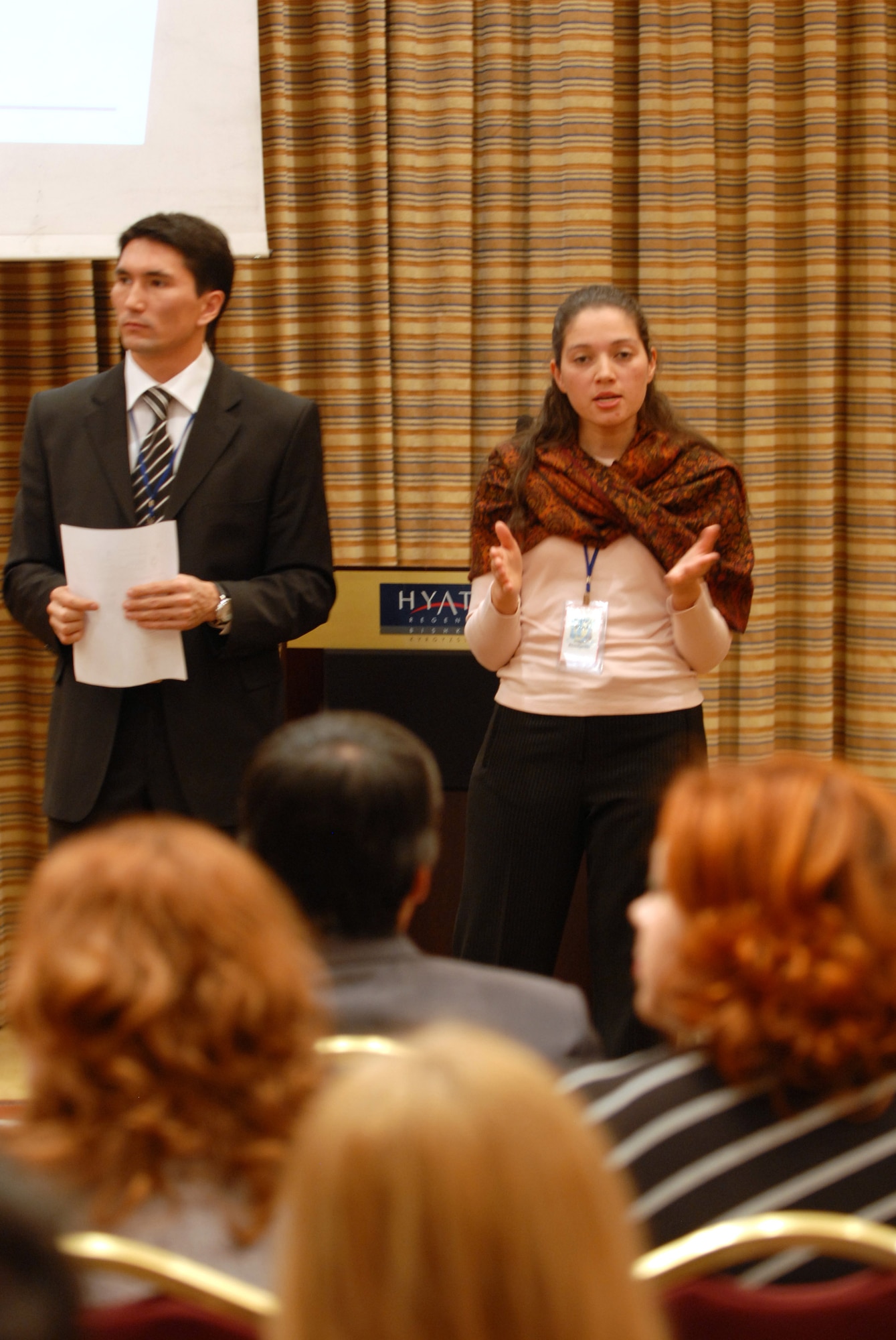 Capt. Rochelle Smith explains the process of bidding and competing for base contracts during a vendor day Nov. 13 at the Hyatt in Bishkek, Kyrgyzstan. The vendor day explained the contract process with local businesses interested in doing work at the base. Captain Smith is the 376th Expeditionary Contracting Squadron commander. (U.S. Air Force photo/Senior Airman Ruth Holcomb) 
