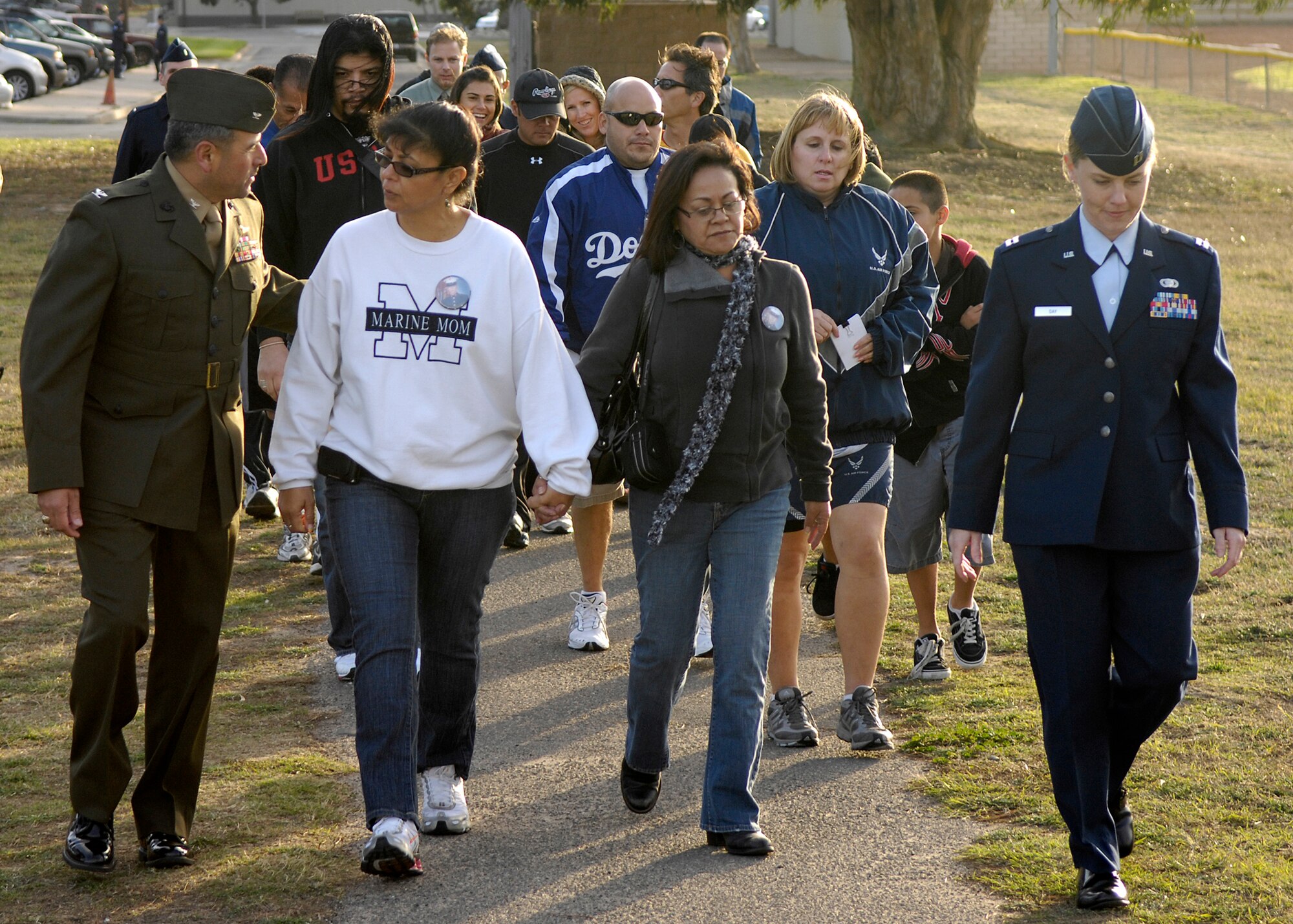 VANDENBERG AIR FORCE BASE, Calif. -- Family and friends of Marine Cpl. Joseph J. Heredia, who died in Fallujah, Iraq, walk to the track before participating in A Run to Remember on Nov. 10. (U.S. Air Force photo/ Airman 1st Class Jonathan Olds)