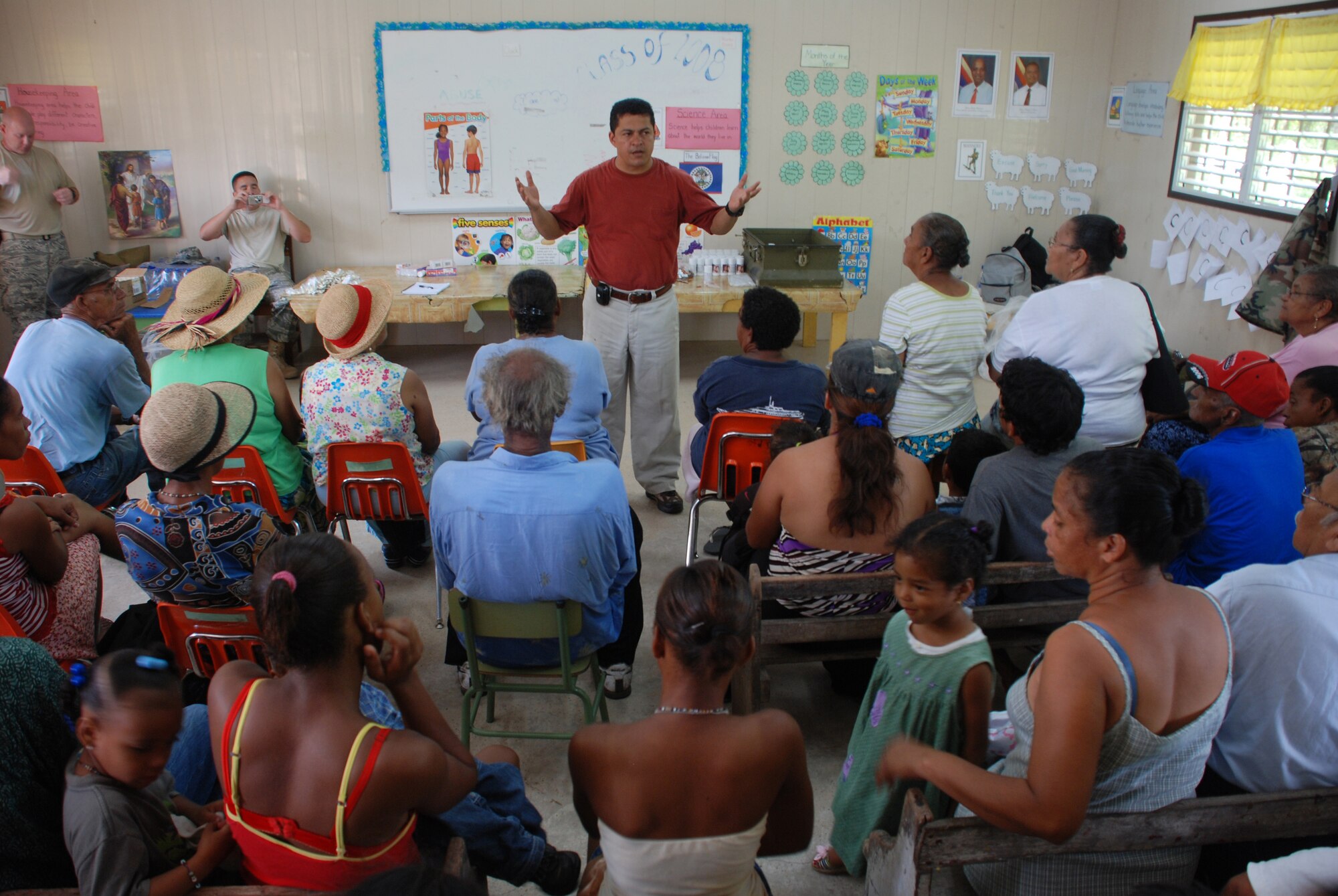 Dr. Wilmer Amador, a Joint Task Force-Bravo medical liaison officer, explains preventative medicine techniques to residents of Crooked Tree, Belize, Nov. 14. More than 600 people were seen by U.S. and Belize military medical personnel in two different villages.