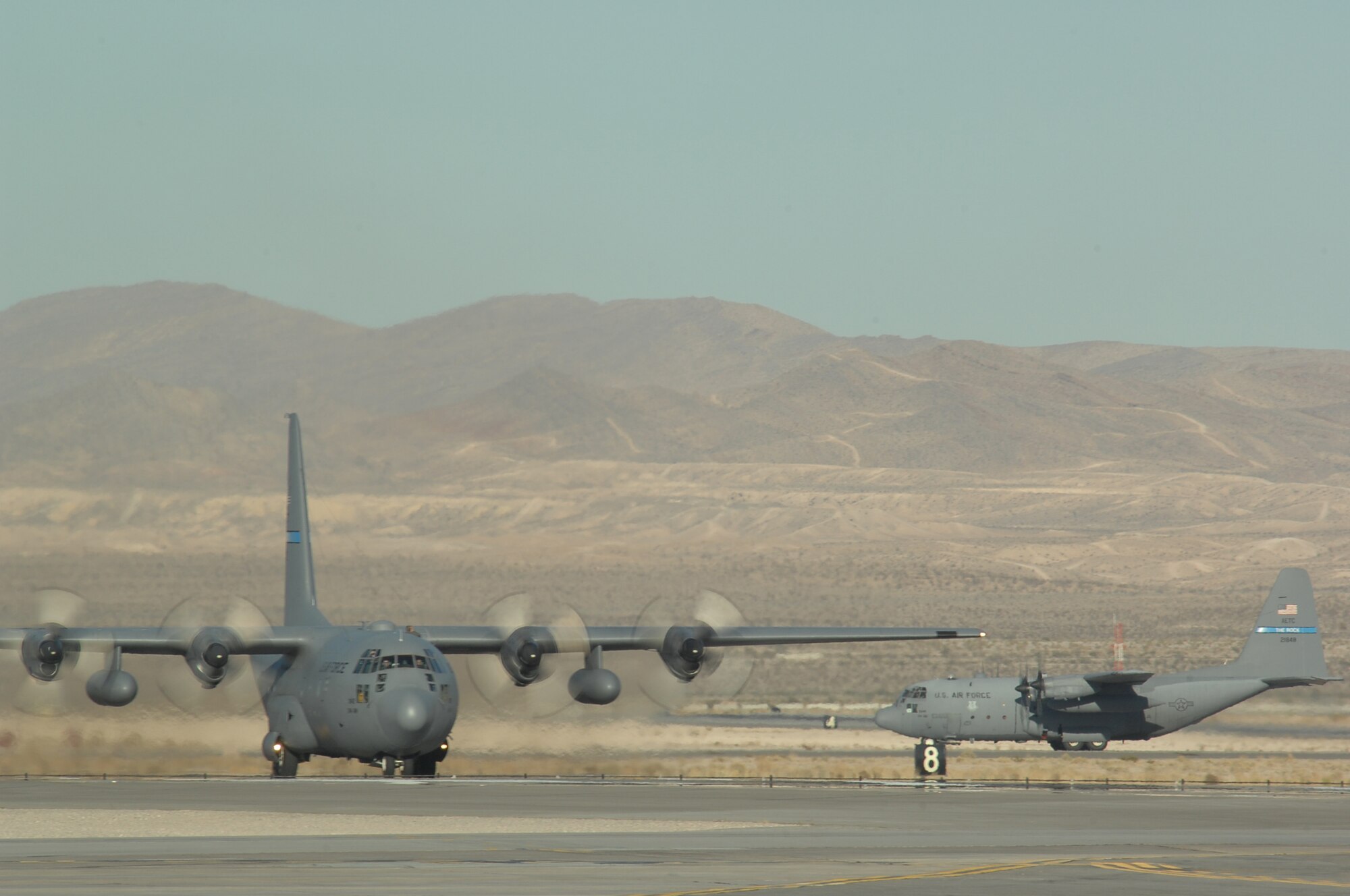 A C-130 Hercules lands during the Mobility Air Forces Exercise, MAFEX, Nov. 19, 2008, Nellis Air Force Base, Nev. Approximately twelve U.S. Air Force bases participate in MAFEX at the U.S. Air Force Weapons School twice a year, testing C-17 Globemasters and C-130 Hercules crews' ability to join together in formation at a specific time and location to drop a brigade-size force anywhere in the world. (U.S. Air Force photo/Senior Airman Brian Ybarbo)
