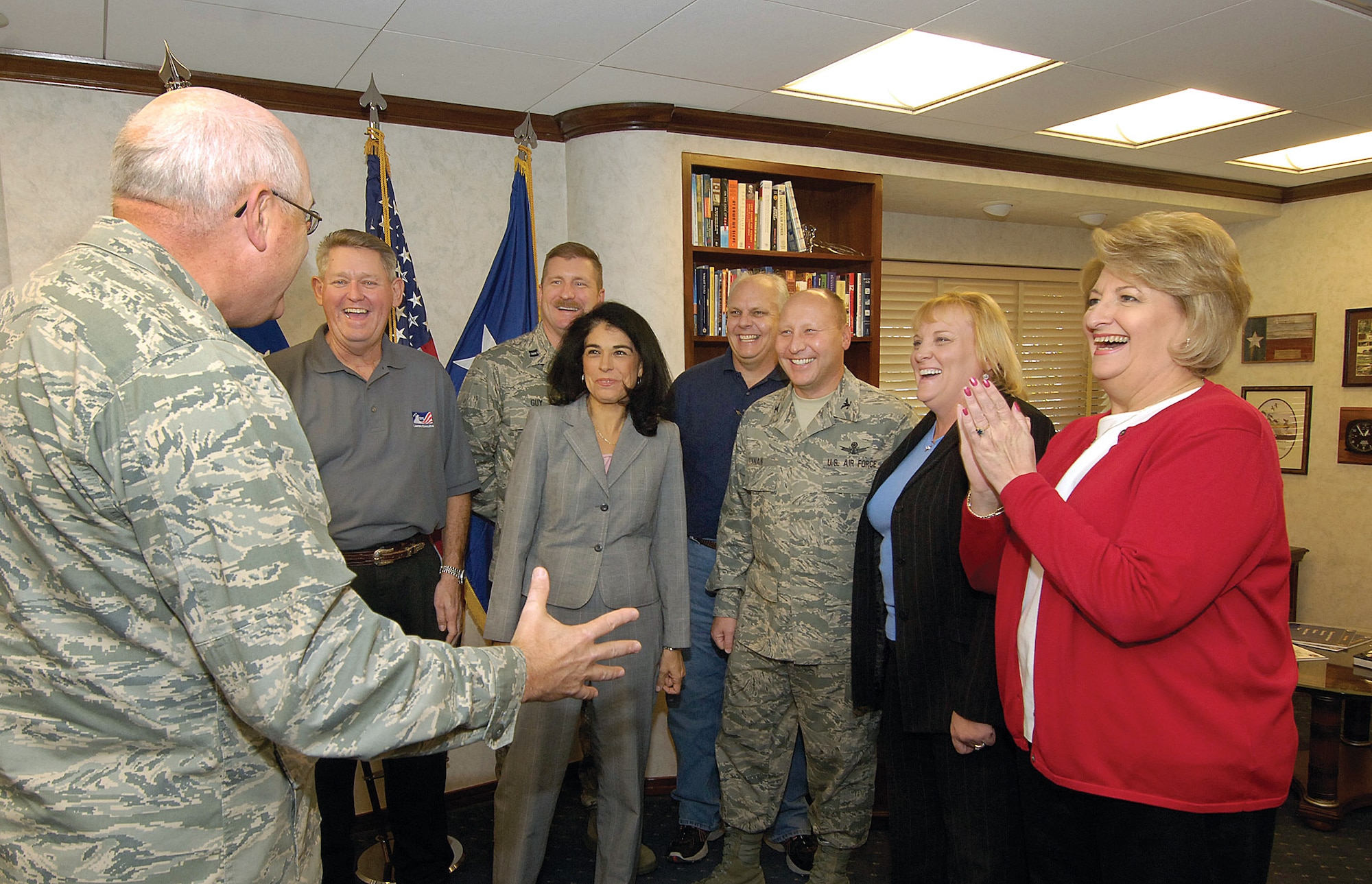 Tinker Combined Federal Campaign key workers react to Oklahoma City Air Logistics Center Commander Maj. Gen. Loren Reno’s happy response when told the base had met its campaign goal early.  Pictured with Gen. Reno in his office are, from left, Larry Marlatt, loaned executive; Capt. David Guy, loaned executive; Natalie Jenne, auditor; David Hutchison, CFC support staff; Col. Tracy Tynan, CFC coordinator; Patti Ripple, commander’s chief of staff; and Carol Bowman, CFC treasurer. (Air Force photo/Margo Wright)