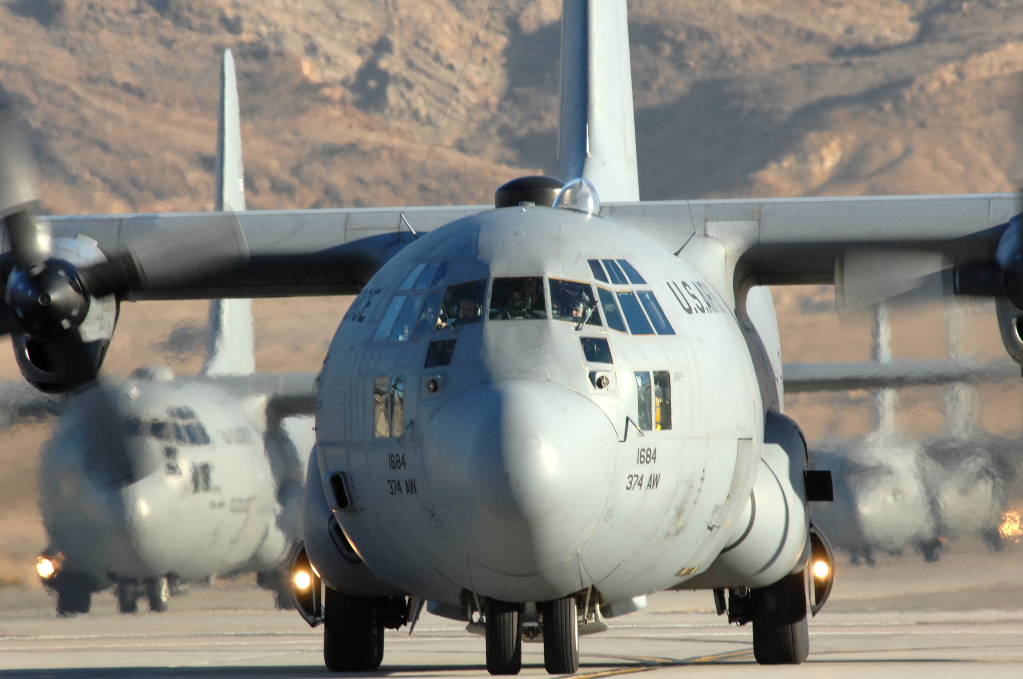 Cargo aircraft taxi during the Mobility Air Forces Exercise, MAFEX, Nov. 19, 2008, Nellis Air Force Base, Nev. Approximately twelve U.S. Air Force bases participate in MAFEX at the U.S. Air Force Weapons School twice a year, testing C-17 Globemasters and C-130 Hercules crews' ability to join together in formation at a specific time and location to drop a brigade-size force anywhere in the world.  (U.S. Air Force photo by Airman 1st Class Brett Clashman)

