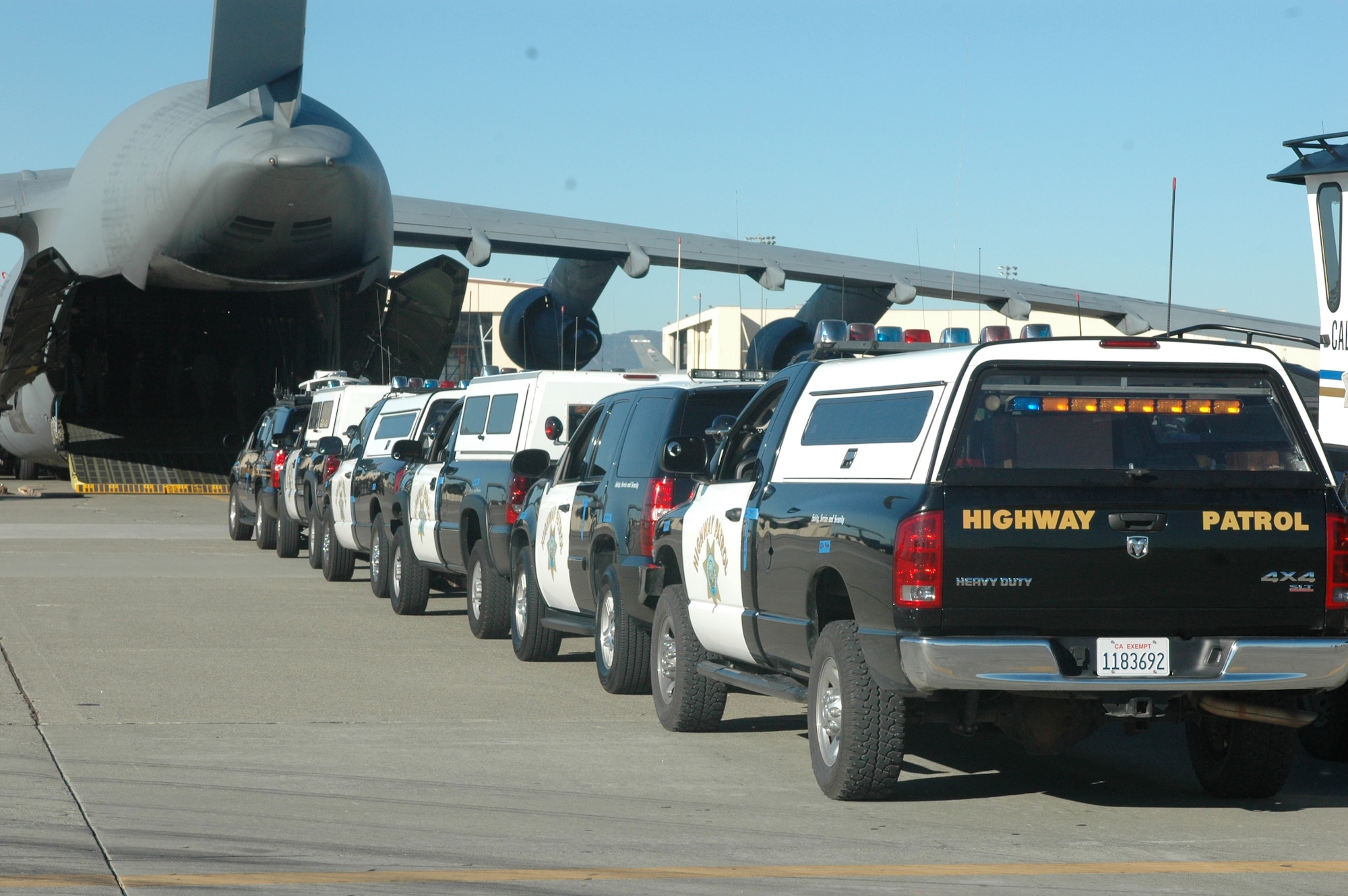 California Highway Patrol vehicles are lined up to board a C-5 Galaxy aircraft during Exercise Golden Guardian Nov. 14. The exercise was designed to test the ability of Team Travis, to process, load and fly the members of the CHP and their equipment to an area in immediate need of their support.  