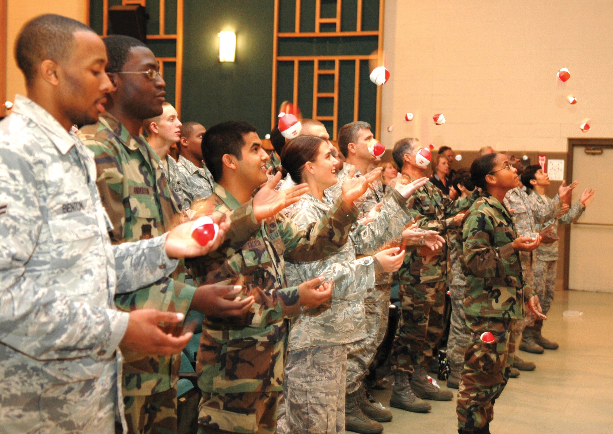 An auditorium full of Airman learned how to juggle, and a little bit about managing life successfully, during a briefing by Curtis Zimmerman at the base theater for Wingman Day Nov. 14. (Air Force photo/Micah Garbarino)