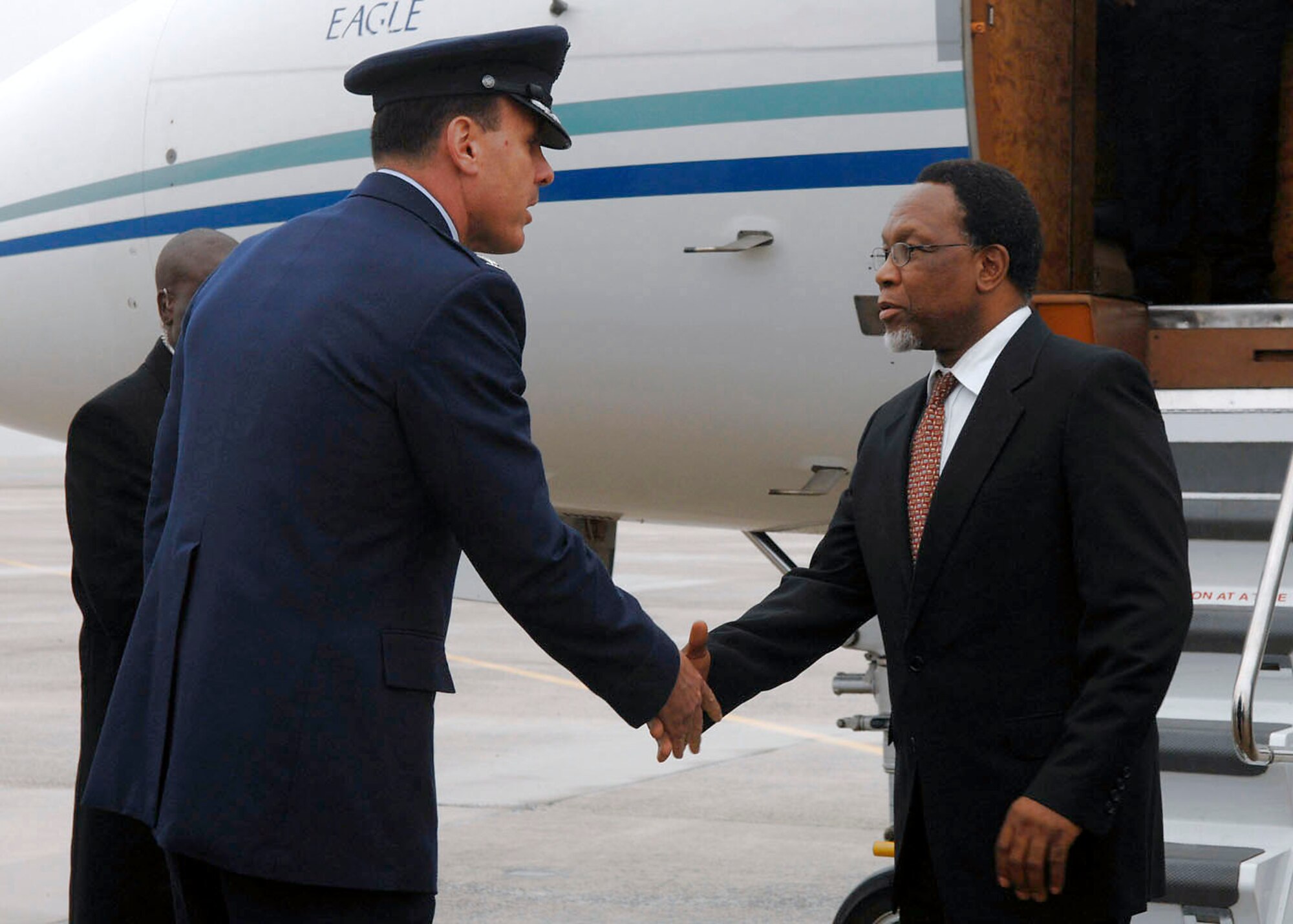Col. Steven M. Shepro greets South African President Kgalema Motlanthe Nov. 14 at Andrews Air Force Base, Md. The South African president was in town for the two-day G-20 Summit at the White House in Washington, D.C. The summit, hosted by President George W. Bush, brought together world leaders to discuss the increasing global financial crisis, its causes and efforts to resolve it. Colonel Shepro is the 316th Wing commander. (U.S. Air Force photo/Senior Airman Melissa Stonecipher)