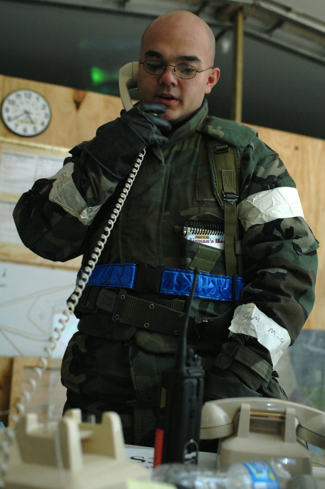 Staff Sgt. Lloyd Theriot, 49th Civil Engineer Squadron, takes a phone call while manning the Tactical Operations Center (TOC) at the CE pit during a phase II exercise at Holloman Air Force Base, N.M., Nov. 19. This is the first exercise that the 49 CES utilized a TOC instead of a Damage Control Center (UCC) during an exercise, due to the squadrons recent tasking with the U.S. Northern Command?s dedicated response force. (U.S. Air Force photo/Airman Sondra M. Escutia)
