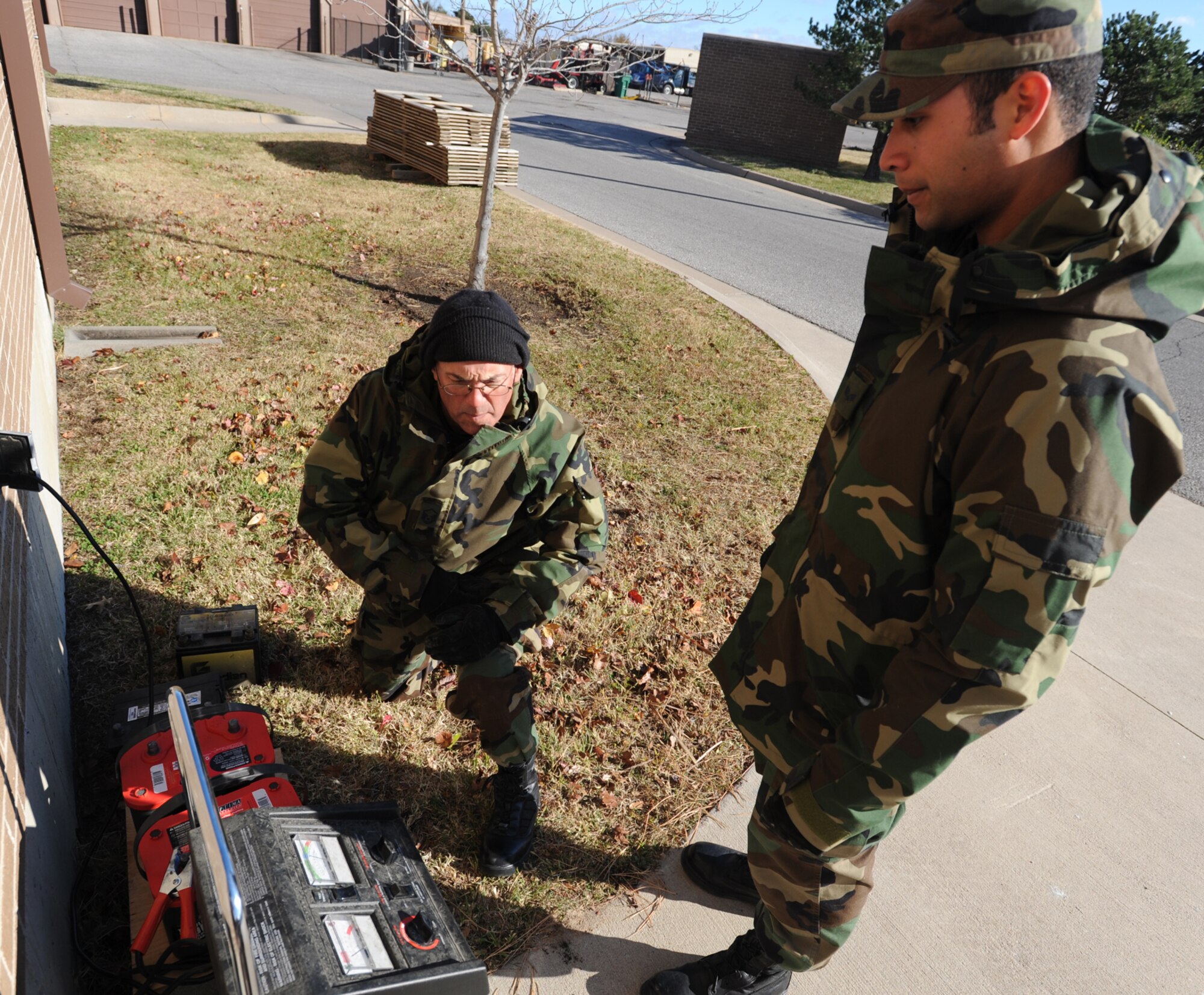Master Sgt. Ed Craig (left) and Senior Airman Jason Garcia check of the progress of charging batteries during the November Unit Training Assembly. Both Airmen are Reservists assigned to Power Production, the CES shop that maintains generators and other equipment used for providing electrical power in deployed and other field conditions. Their squadron is part of the 931st Air Refueling Group, an Air Force Reserve unit at McConnell Air Force Base, Kan. (U.S. Air Force photo/Tech. Sgt. Jason Schaap)