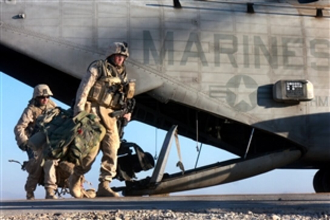 U.S. Marines exit a CH-53 Super Stallion helicopter on Camp Bastion in Afghanistan, Nov. 17, 2008. The Marines are assigned to Foxtrot Company, 2nd Battalion, 7th Marine Regiment.