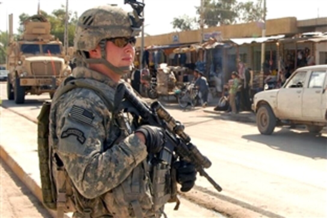 U.S. Army Sgt. James Artman sets a perimeter to provide security in the market area of Jurf Assakkar, Iraq, Nov. 11, 2008. Artman is assigned to the 3rd Infantry Division's Company A, 3rd Battalion, 7th Calvary Regiment, 4th Brigade Combat Team. 