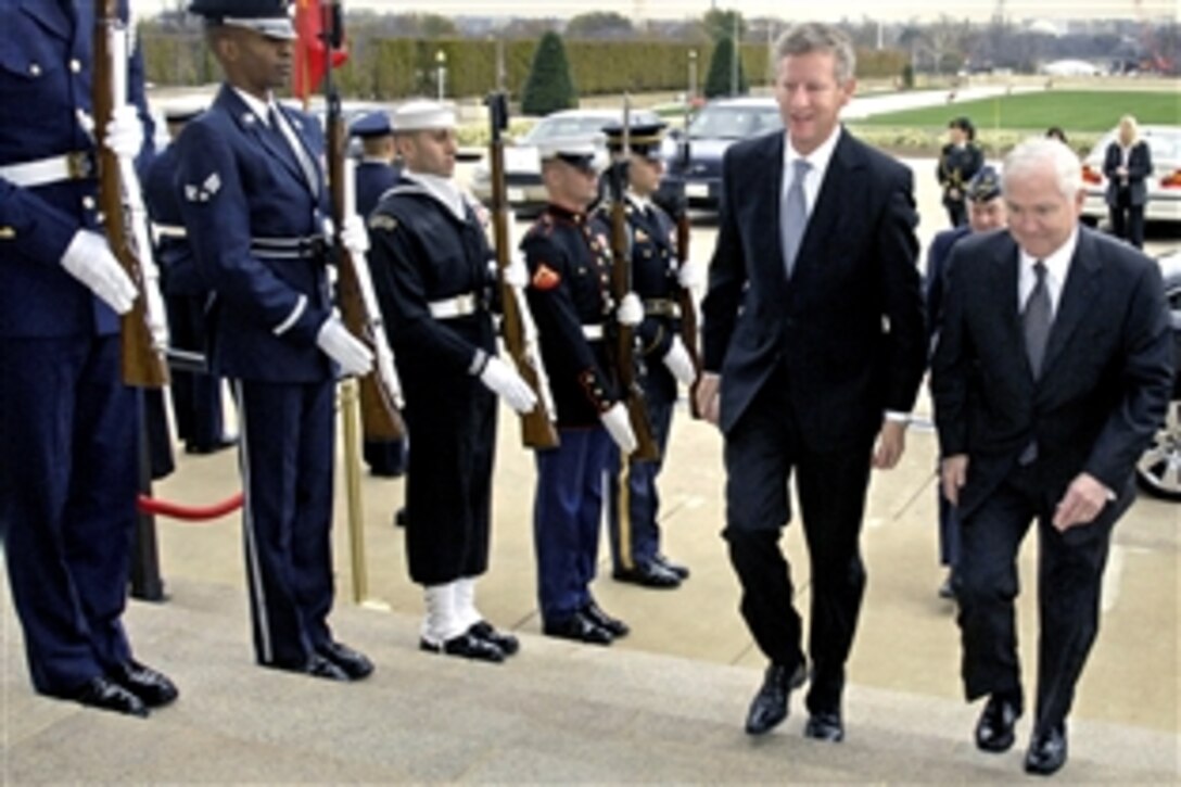 U.S. Defense Secretary Robert M. Gates, right, escorts Belgian Minister of Defense Pieter de Crem through an honor cordon into the Pentagon, Nov. 20, 2008. The two defense leaders will discuss bilateral security issues. 