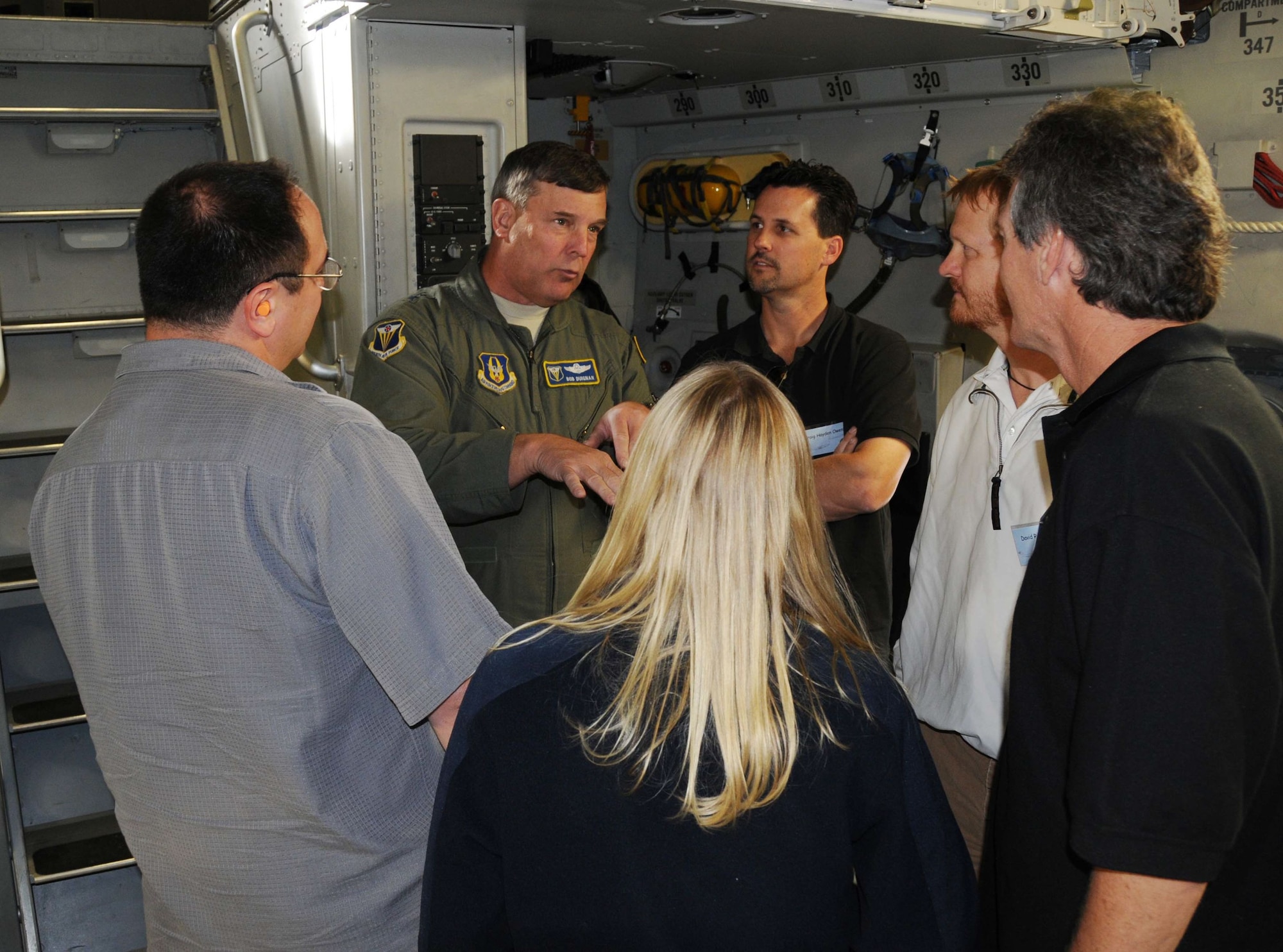 Maj. Gen. Robert E. Duignan, 4th Air Force commander explains to members of the entertainment industry the particulars of air refueling aboard a C-17. (U.S. Air Force photo by Lt. Col. Francisco Hamm)