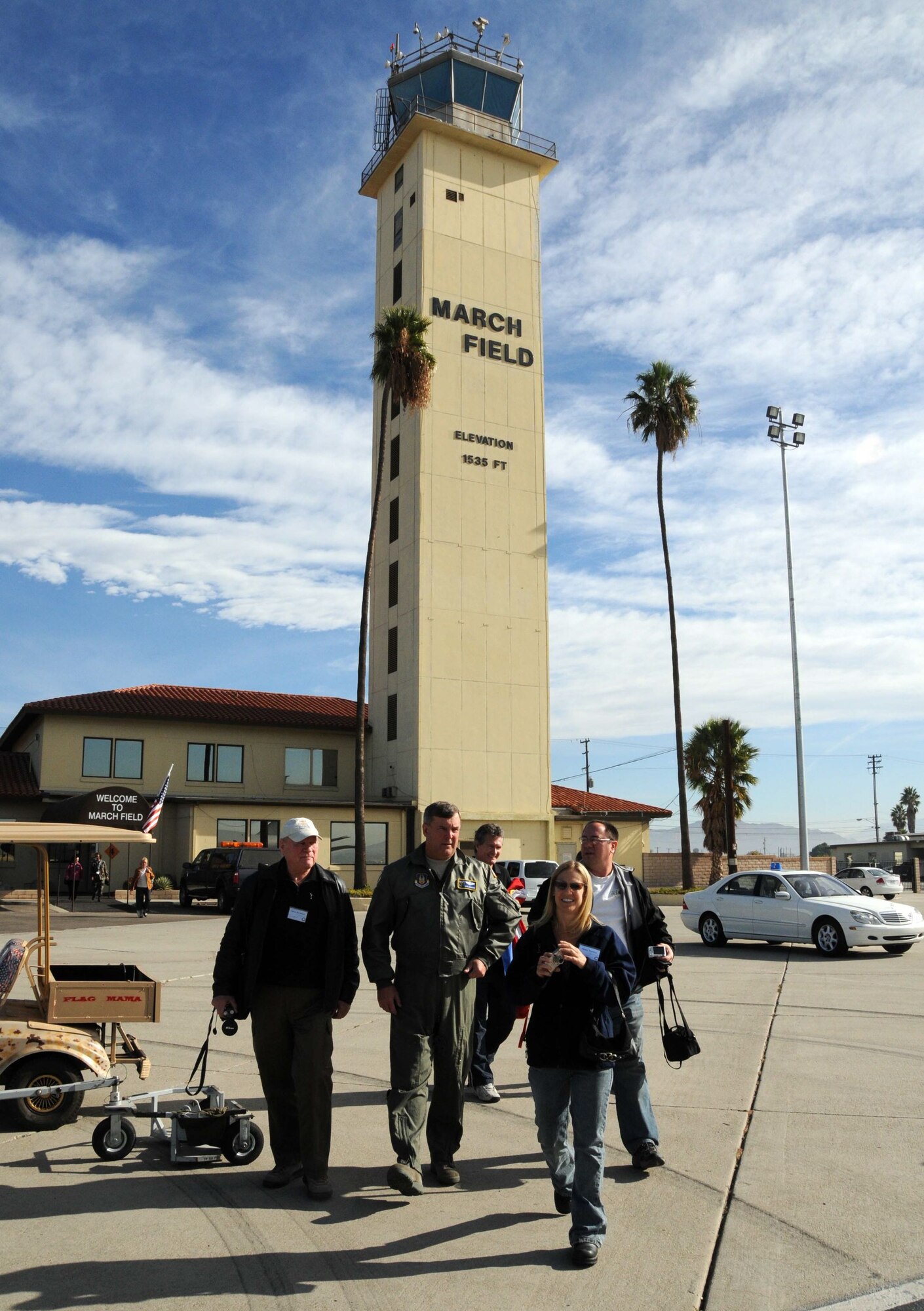 Maj. Gen. Robert E. Duignan, 4 AF commander, walks out to the tarmac with members of the entertainment industry before an air refueling mission as part of Air Force Week. The week of Nov 14-21 was a platform for Airmen to share the Air Force story with fellow citizens. It included community visits and talks by Air Force officials, flight demonstrations and displays. (U.S. Air Force photo by Lt. Col. Francisco Hamm)