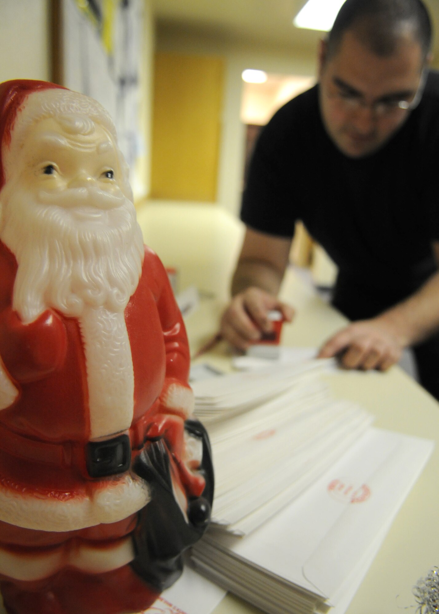 Staff Sgt. Matthew Bohlman, 354th Operations Support Squadron weather technician, responds to a child's letter addressed from Santa Claus as a part of the Santa's Mailbag program, Nov 21, 2008, Eielson AFB, Alaska.  The 354th OSS's Santa's Mailbag program reads and responds to letters written from children all over the world. This program has been active for 54 years and is a holiday tradition for the men and women of the 354th Operation Support Squadron weather flight.  To send letters to Santa, send a self-addressed, stamped envelope to:  SANTA'S MAILBAG, 354th OSS/OSW, 2827 Flightline Ave., Suite 100B, Eielson AFB, Alaska 99702.   (U.S Air Force photo/Staff Sgt. Tia Schroeder)