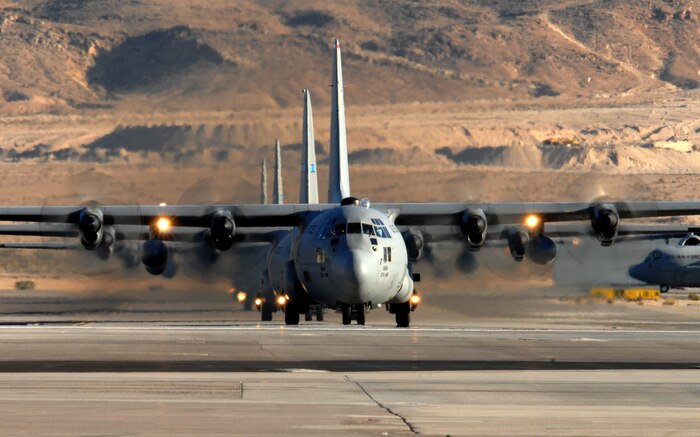A formation of C-130 Hercules taxis in after a training mission during the U.S. Air Force Weapons School's Mobility Air Forces Exercise, MAFEX, at Nellis Air Force Base, Nev., Nov. 19, 2008. Approximately twelve U.S. Air Force bases participate in MAFEX at the U.S. Air Force Weapons School twice a year, testing C-17 Globemasters and C-130 Hercules crews' ability to join together in a formation at a specific time and location to drop a brigade sized force anywhere in the world. (U.S. Air Force Photo/Senior Airman Larry E. Reid Jr., Released)