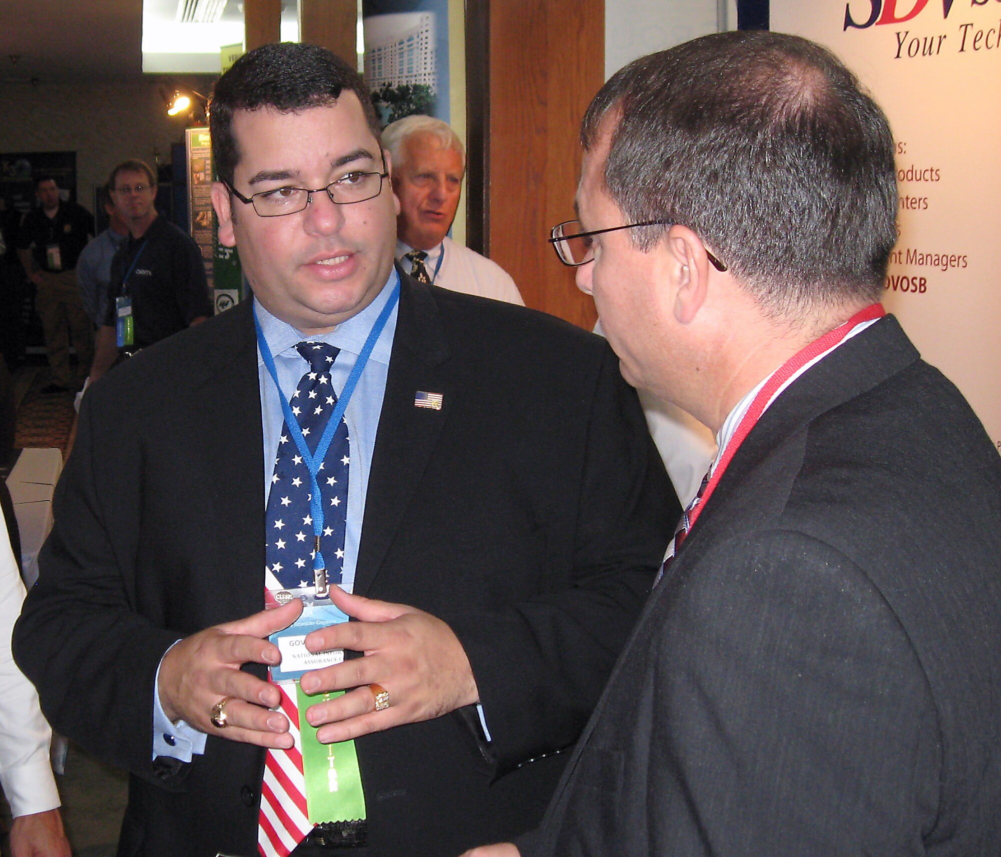 Ronald A. Poussard (right) speaks with Giovanni Suarez at the 2008 Service-Disabled Veteran-Owned Small Business Technology Conference and Expo Nov. 14 at MacDill Air Force Base, Fla. Mr. Poussard is the director of the Secretary of the Air Force Small Business Programs. Mr. Suarez is president and CEO of National Information Assurance Corporation. (Courtesy photo/CorpComm Inc.) 
