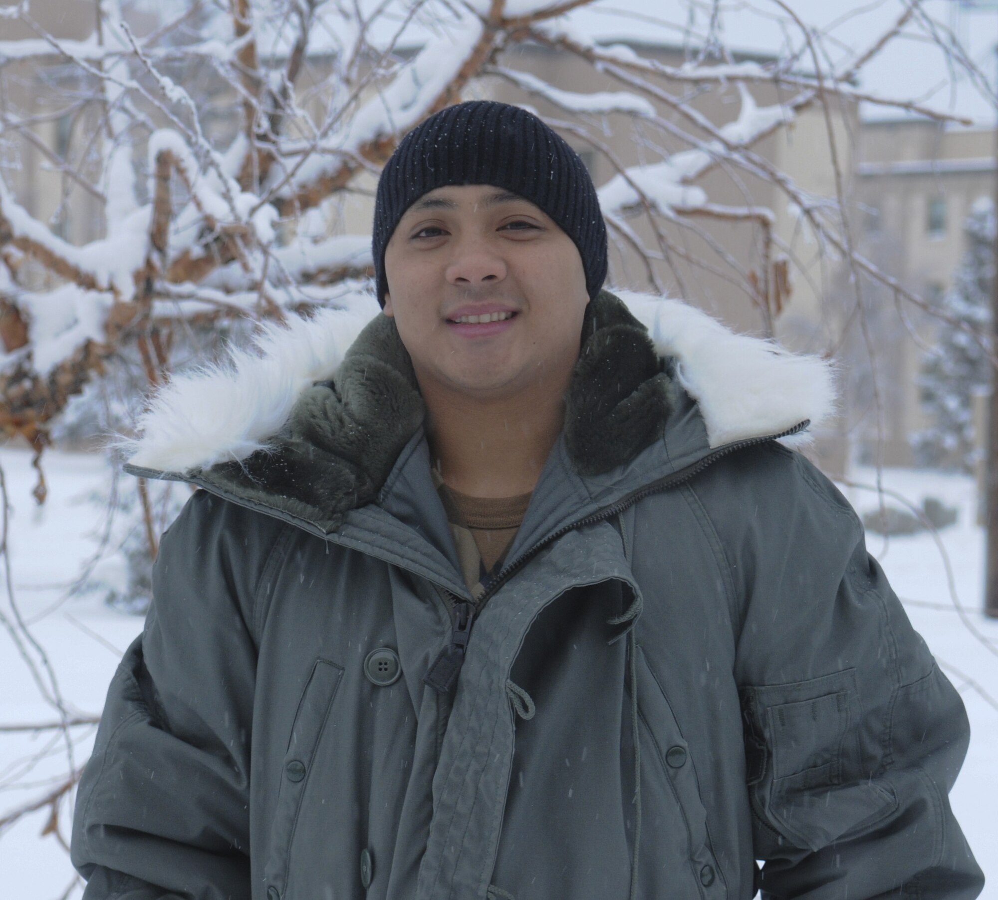 Airman 1st Class Jeffrey Caloobanan, 354th Force Support Squadron, enjoys being home in Concord, CA and playing football during the day to work up an appetite. In the evening, Airman Caloobanan enjoys a large dinner with family and watching the football game.  (U.S. Air Force photo/ Airman Laura Max)