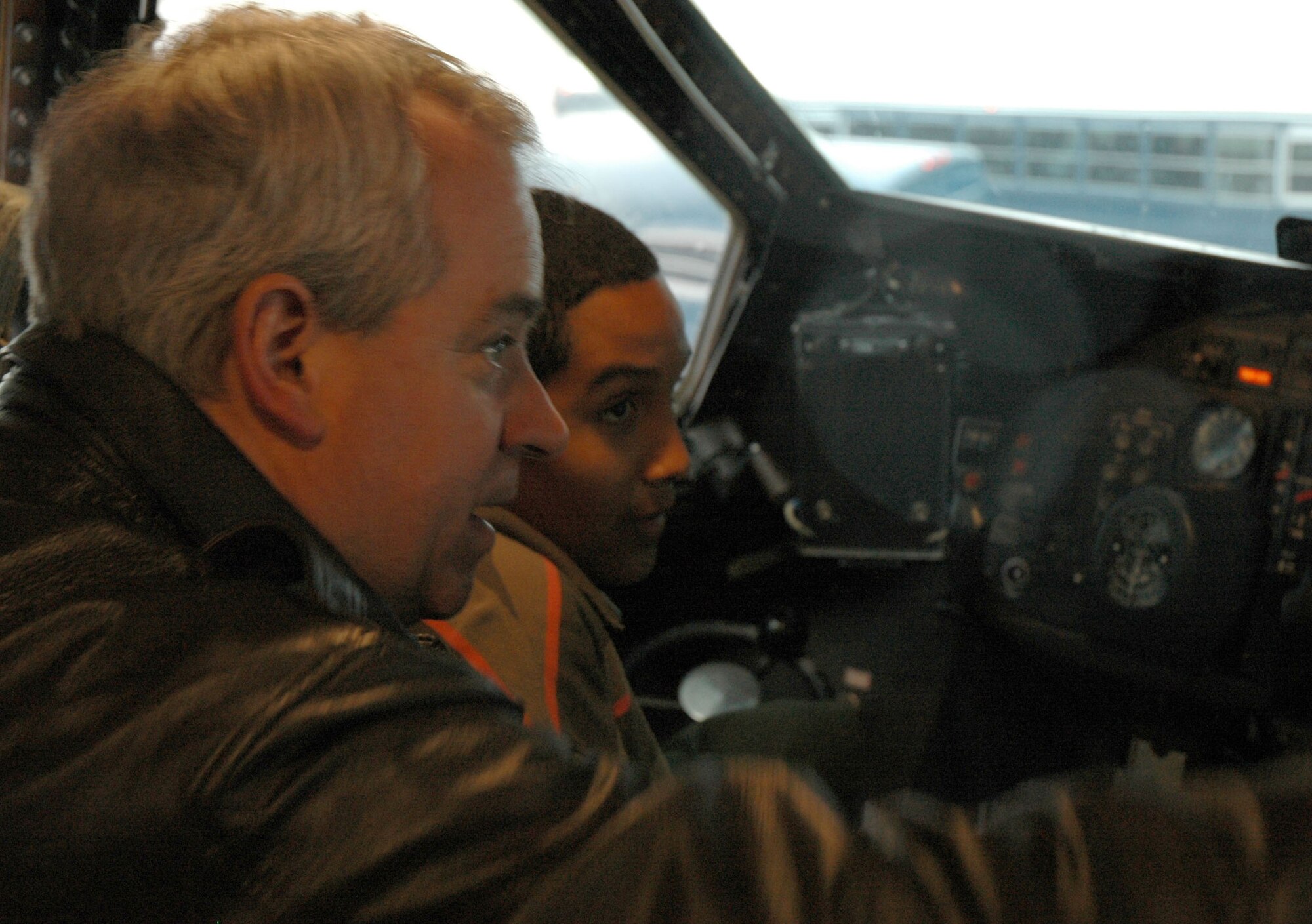 Lt. Col. Gregory Symonds, 439th Operations Support Squadron commander, explains the flight deck of a C-5B Galaxy to a Junior ROTC member during the Hispanic Youth Symposium held in April at the base. (US Air Force photo/Maj. Wilson Camelo)