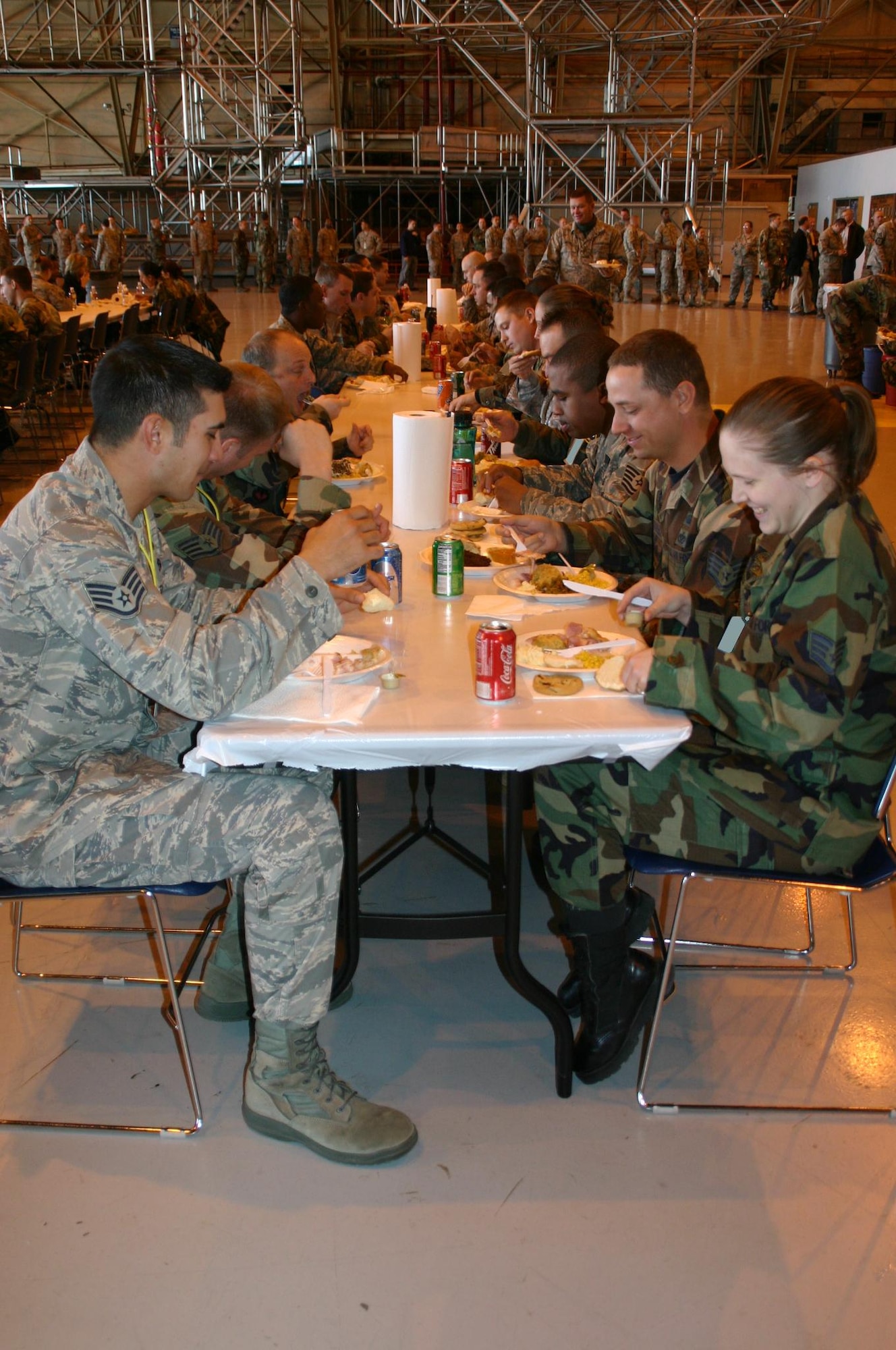 Airmen from the 552nd Maintenance Group enjoy plates piled high of turkey and all the fixings at the annual MXG Turkey Feast November 20. Photo compliments of 1st Lt. Kinder Blacke.