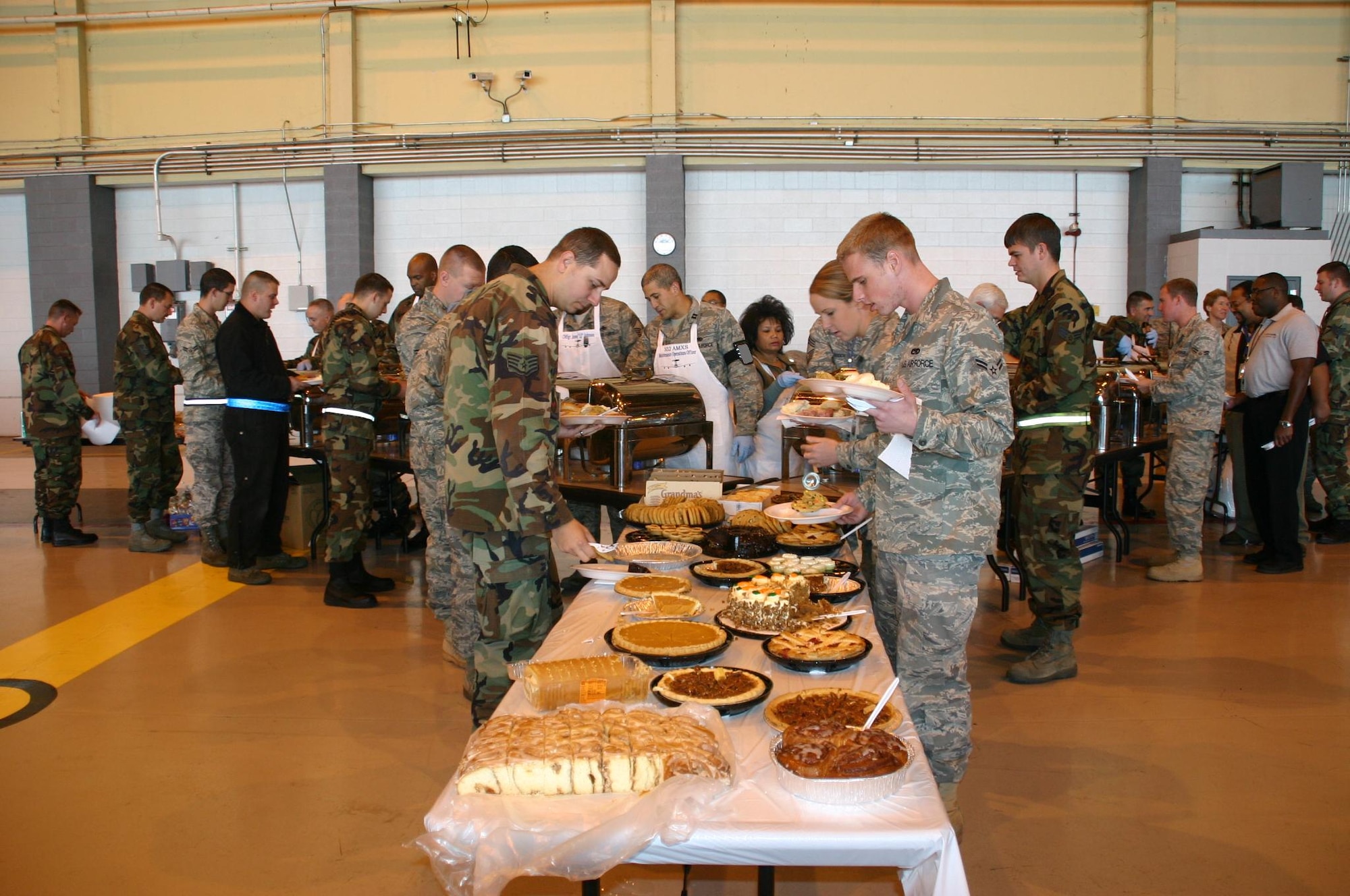 Airmen from the 552d Maintenance Group enjoy a plentiful Thanksgiving feast November 20 to kick off the holiday season. 