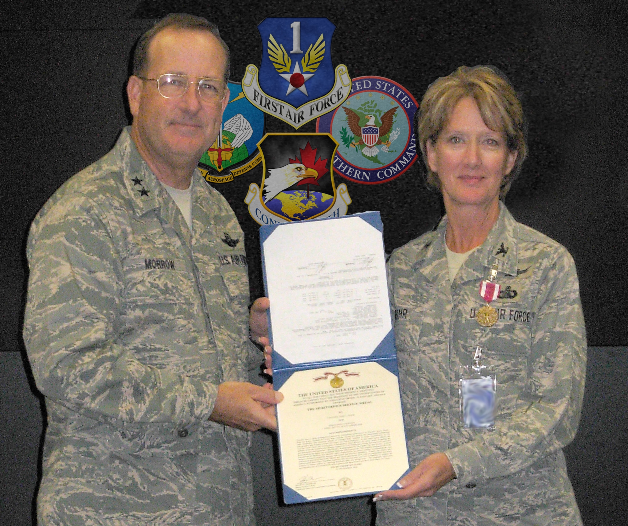 Maj. Gen. Hank Morrow, CONR-AFNORTH commander, presents Air Force Reserve Col. Jane Rohr with the Meritorious Service Medal for her contributions to the Joint Forces Air Component Commander. Graphic illustration by Master Sgt. Jerry D Harlan