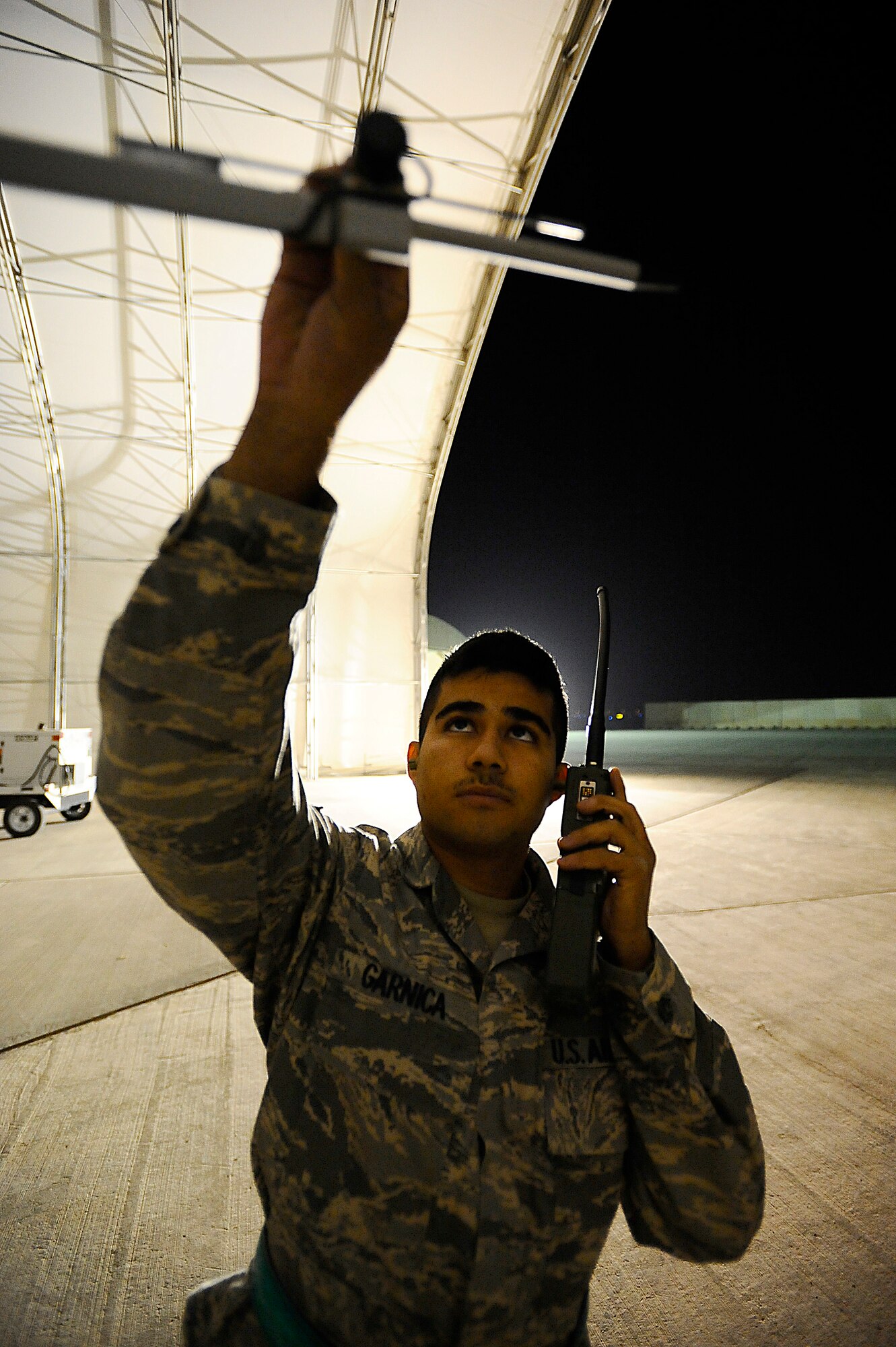 Airman 1st Class Hugo Garnica inspects the angle of attack indicator on an MQ-9 Reaper at Joint Base Balad, Iraq, Nov. 18. This indicator on the unmanned aircraft vehicle measures the pitch of the aircraft. Garnica, an assistant dedicated crew chief assigned to the 332nd Expeditionary Aircraft Maintenance Squadron, was performing a pre-flight check to ensure the aircraft was operational. He is an Oceanside, Calif., native deployed from Creech Air Force Base, Nev. (U.S. Air Force photo/Airman 1st Class Jason Epley)