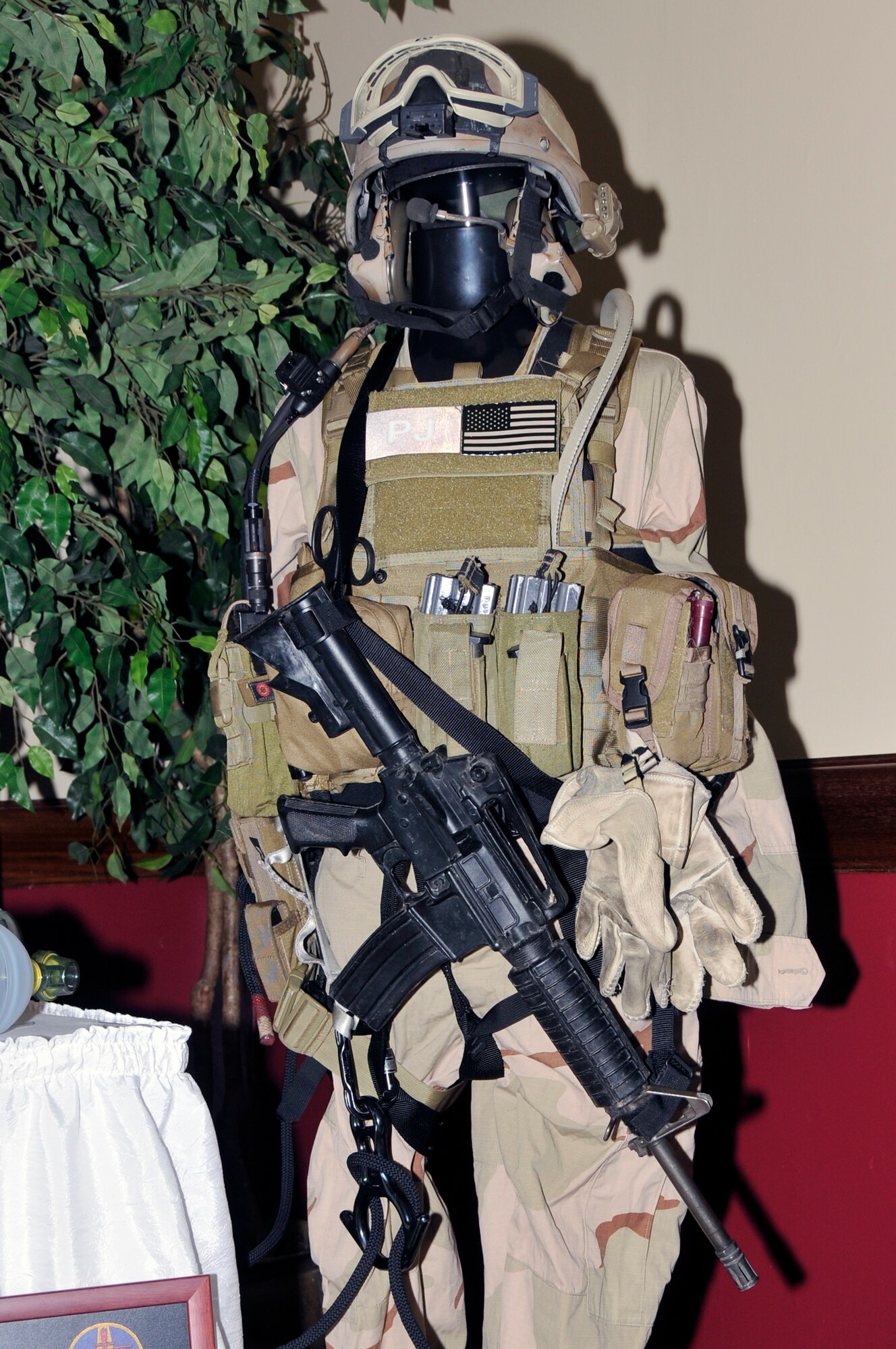 The 56th Rescue Squadron's Pararescuemen display one of their uniform and equipment normally used to conduct rescue missions Nov 14 at RAF Lakenheath, England. The  48th Fighter Wing displayed the capabilities of the wing during the 60th anniversary of RAF Lakenheath. (U.S. Air Force photo by Airman 1st Class Perry Aston)
