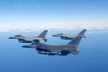An 80th Fighter Squadron F-16 flies in formation with Republic of Korea Air Forces' KF-16s from the 159th Fighter Squadron while participating in the Buddy Wing program at Jungwon Air Base, Republic of Korea, Nov. 20, 2008.  The Buddy Wing program is designed to further increase U.S. Air Force and ROKAF interoperability in an aerospace conflict by having pilots from each air force fly with and against each other. (U.S. Air Force Photo by Staff Sgt. Jason Colbert)