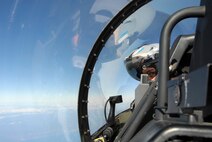 First Lt. Matt Crabb, 80th Fighter Squadron, looks over his shoulder for enemy aircraft while  while participating in the Buddy Wing program at Jungwon Air Base, Republic of Korea, Nov. 20, 2008.  The Buddy Wing program is designed to further increase U.S. Air Force and Republic of Korea Air Forces' interoperability in an aerospace conflict by having pilots from each air force fly with and against each other. (U.S. Air Force Photo by Staff Sgt. Jason Colbert)