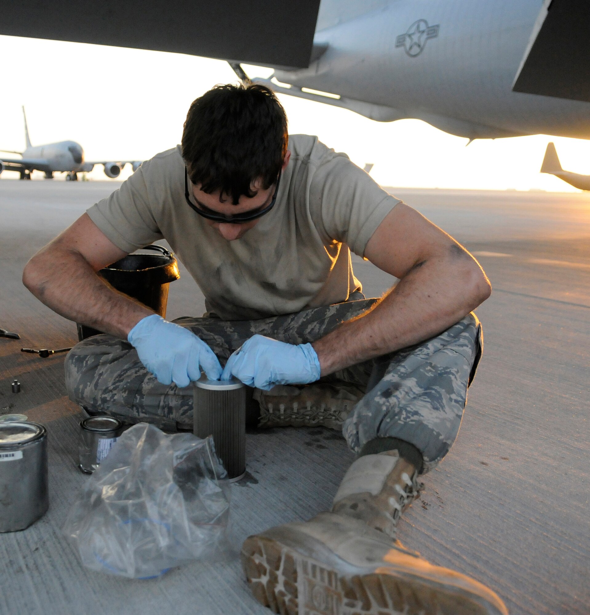 Airman 1st Class Alexander Lesch, 379th Expeditionary Aircraft Maintenance Squadron, works a new seal into place on a fuel filter during a 120-hour inspection on a KC-135 Stratotanker engine, Nov. 20, at an undisclosed air base in Southwest Asia.   The KC-135 Stratotanker provides the core aerial refueling capability for the United States Air Force and also provides aerial refueling support to Navy, Marine Corps and allied nation aircraft in the Central Command area of responsibility.  Airman Lesch is a native of Burlington, Wis., and is deployed from Grand Forks Air Force Base, N.D., in support of Operations Iraqi and Enduring Freedom and Joint Task Force-Horn of Africa.  (U.S. Air Force photo by Tech. Sgt. Michael Boquette/Released)