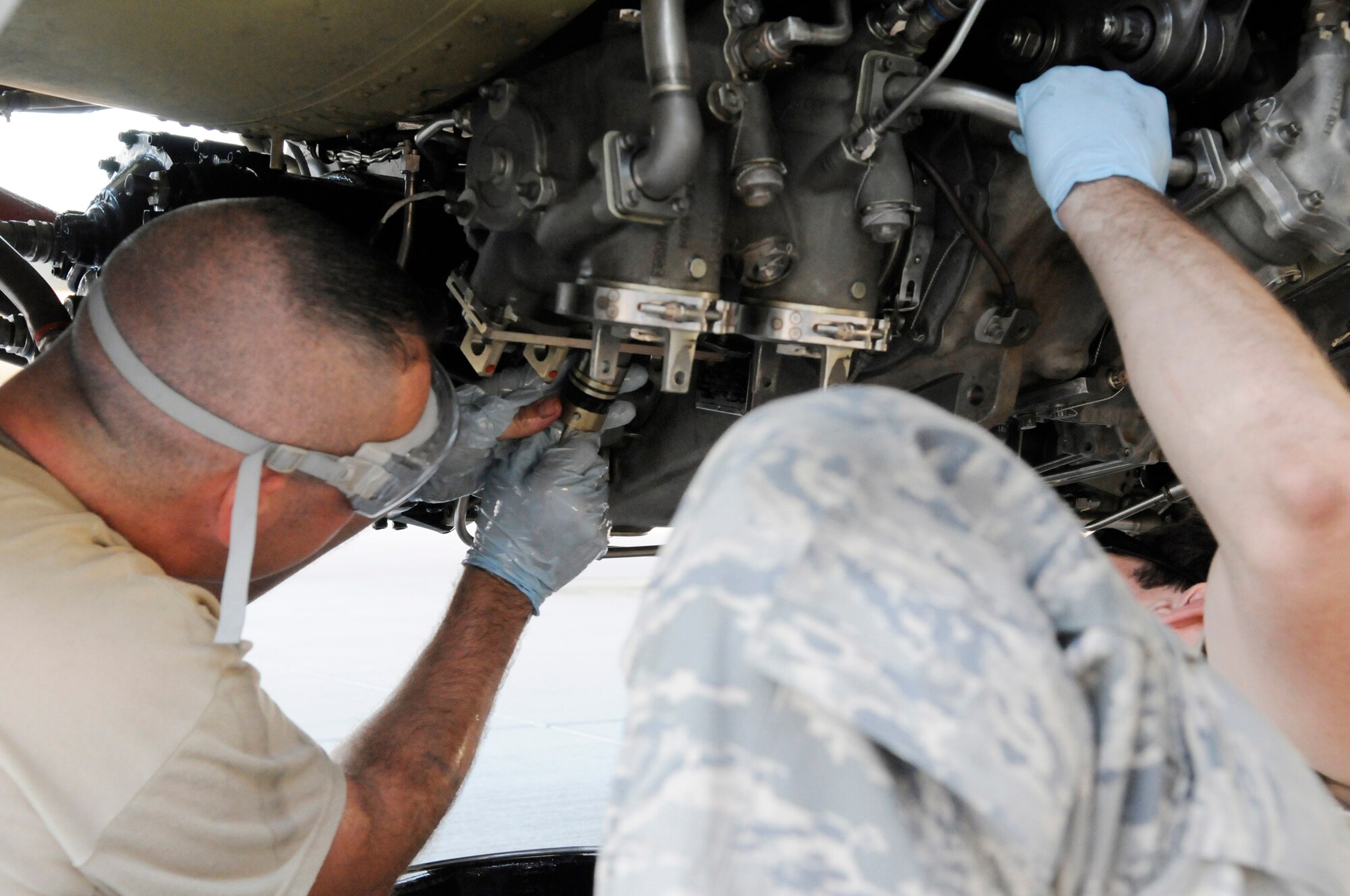 Staff Sgt. Eric Mutschlechner, 379th Expeditionary Aircraft Maintenance Squadron, replaces an engine magnetic chip during a 60-hour inspection on a KC-135 Stratotanker engine, Nov. 20, at an undisclosed air base in Southwest Asia.   The KC-135 Stratotanker provides the core aerial refueling capability for the United States Air Force and also provides aerial refueling support to Navy, Marine Corps and allied nation aircraft in the Central Command area of responsibility.  Sergeant Mutschlechner is a native of San Marcos, Texas, and is deployed from MacDill Air Force Base, Fla., in support of Operations Iraqi and Enduring Freedom and Joint Task Force-Horn of Africa.  (U.S. Air Force photo by Tech. Sgt. Michael Boquette/Released)