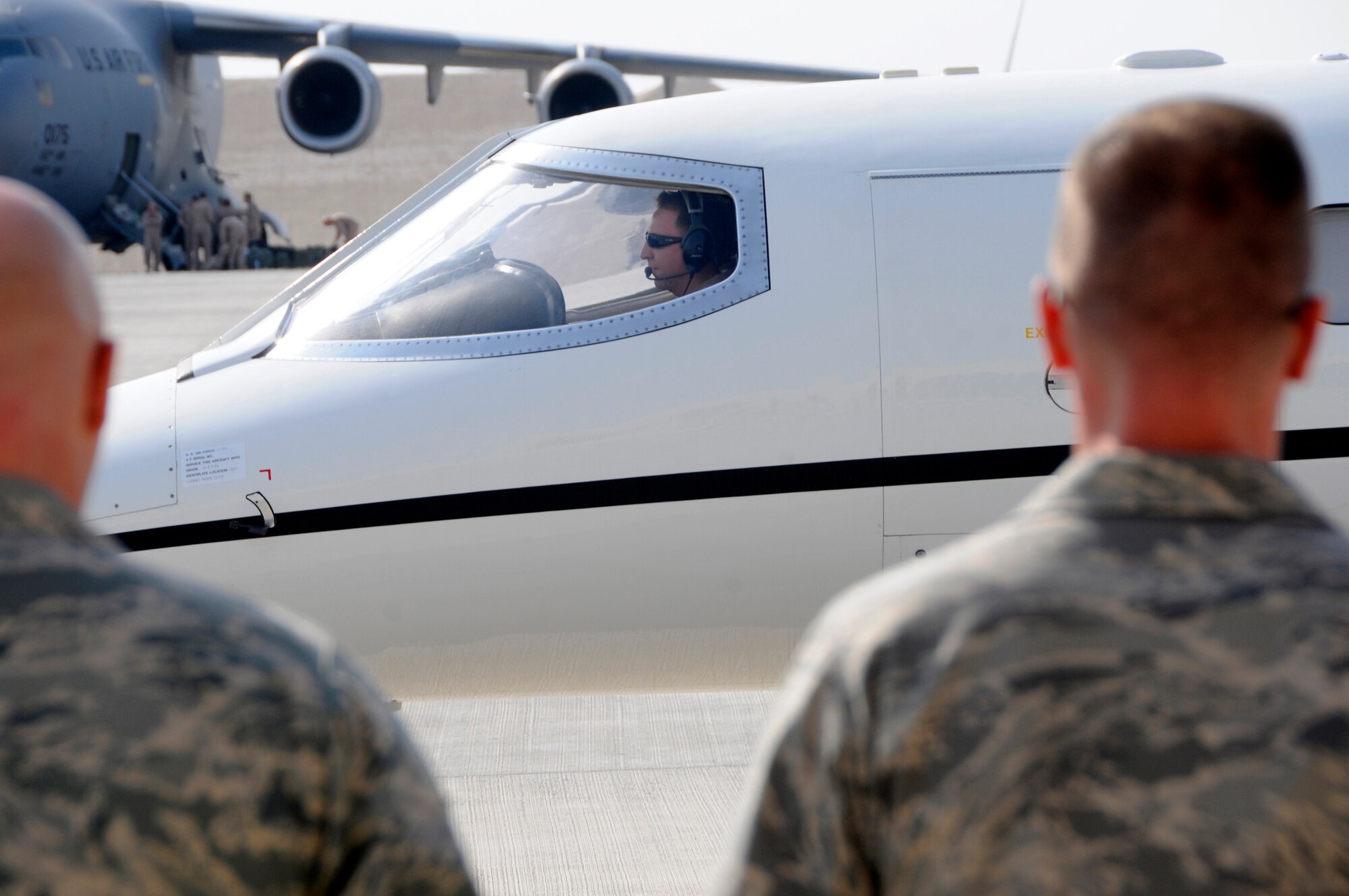 Capt. Kaaba Kraner, C-21 pilot assigned to the 379th Expeditionary Operations Group, prepares to take off. The C-21 is a twin turbofan engine aircraft used for cargo and passenger airlift. In addition to providing cargo and passenger airlift, the aircraft is capable of transporting one litter or five ambulatory patients during aeromedical evacuations. Captain Kraner is deployed from Andrews Air Force Base, Md., in support Operations Iraqi and Enduring Freedom and Joint Task Force-Horn of Africa. (U.S. Air Force photo by Tech. Sgt. Michael Boquette/Released)