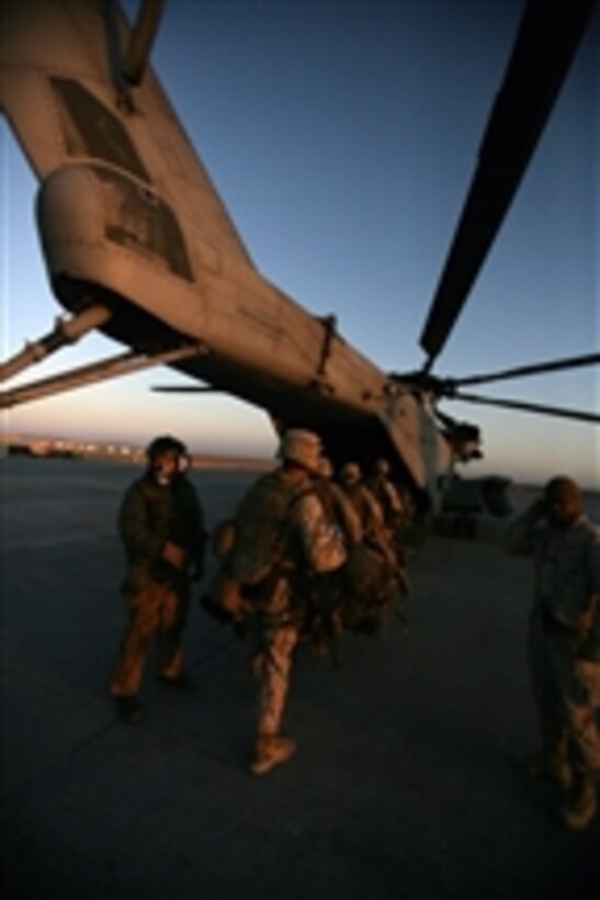 U.S. Marines from Lima Company, 3rd Battalion, 8th Marine Regiment board a CH-53E Super Stallion helicopter at Camp Bastion in the Helmand province of Afghanistan on Nov. 17, 2008.  The Marines are taking over operations in the area from Marines with 2nd Battalion, 7th Marine Regiment out of Marine Air Ground Combat Center at Twentynine Palms, Calif.  